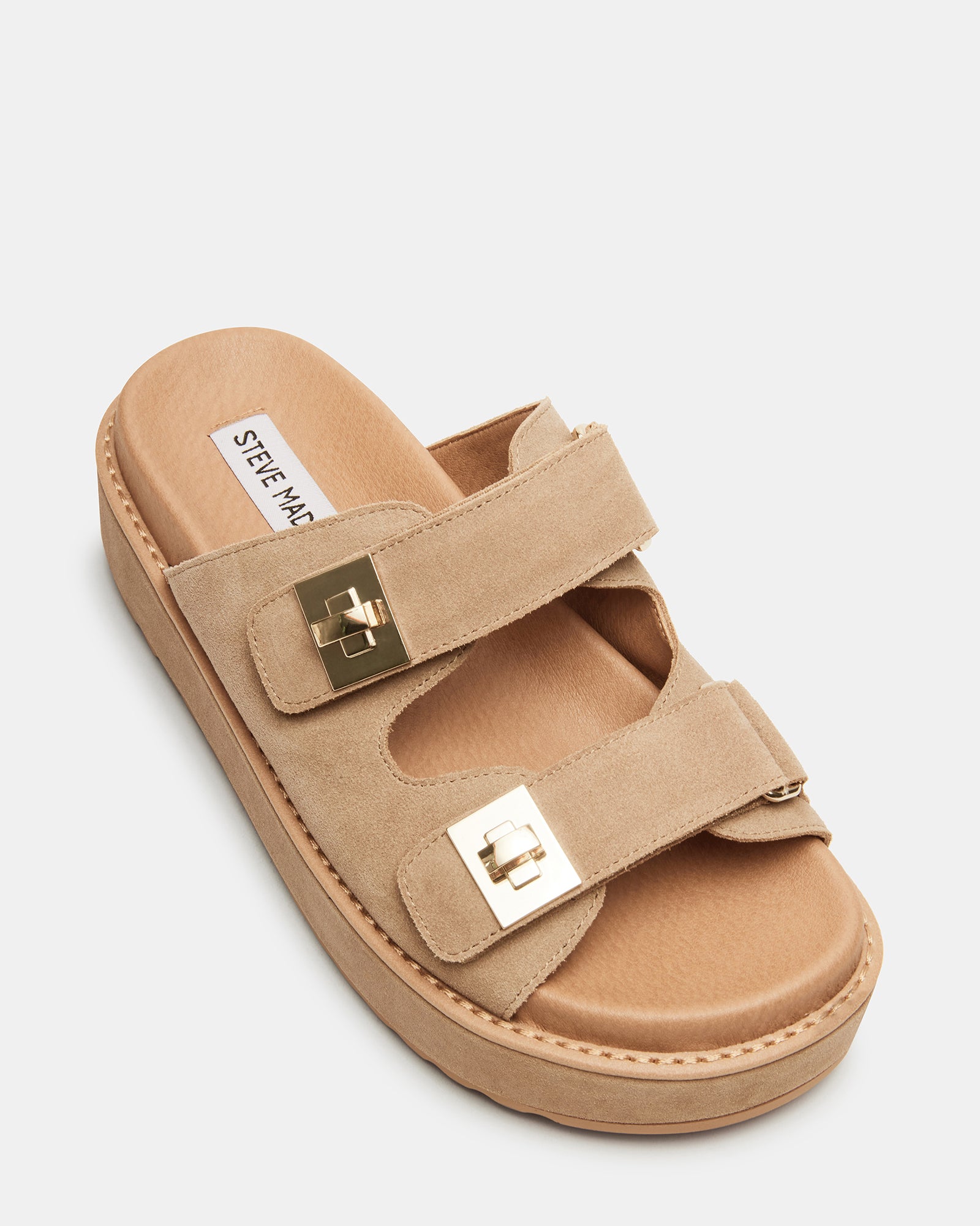 BIGSCHMONA taupe suede platform sandals on a wooden deck