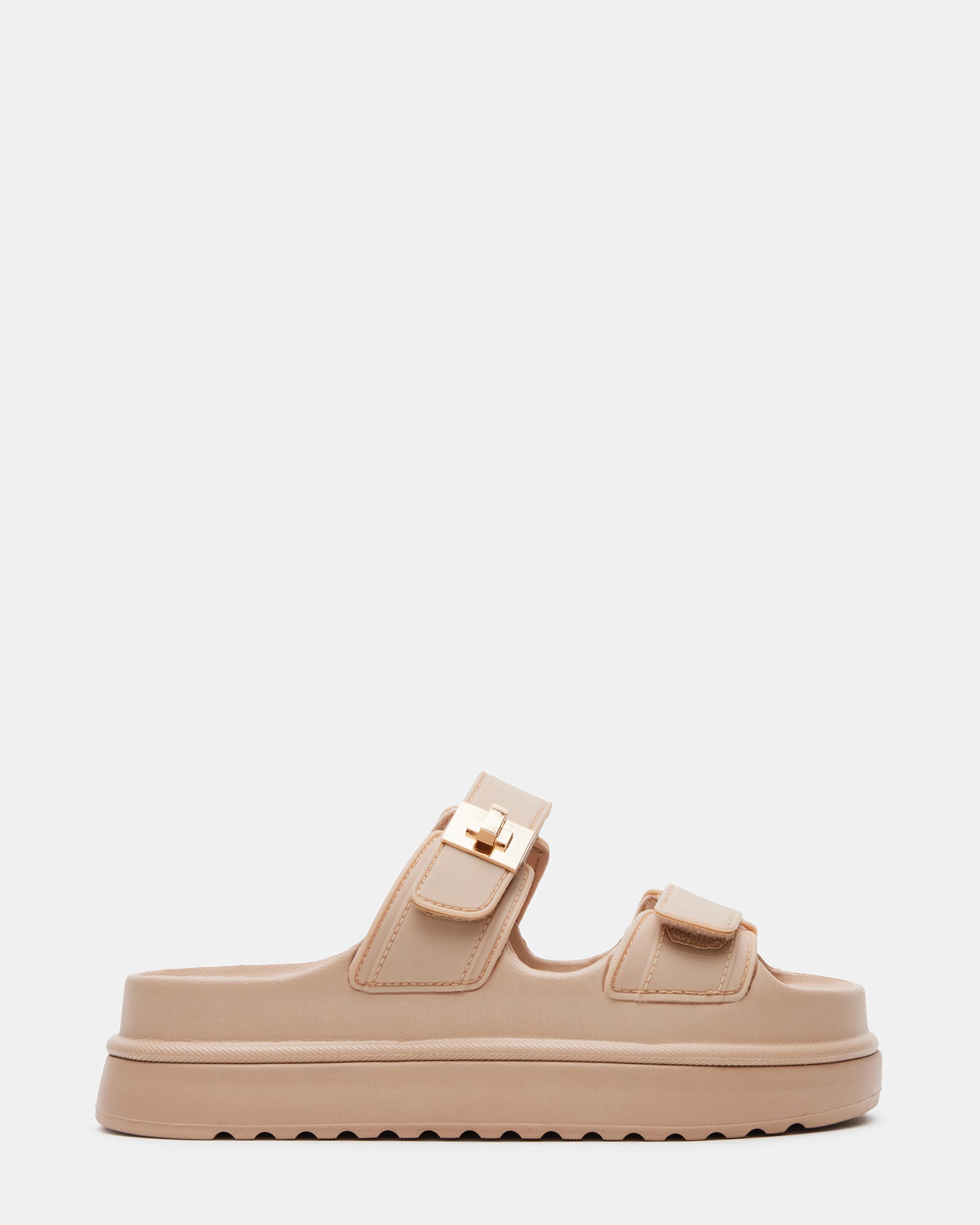 Side view of BIGSCHMONA Jelly Natural platform slide sandals on a city street