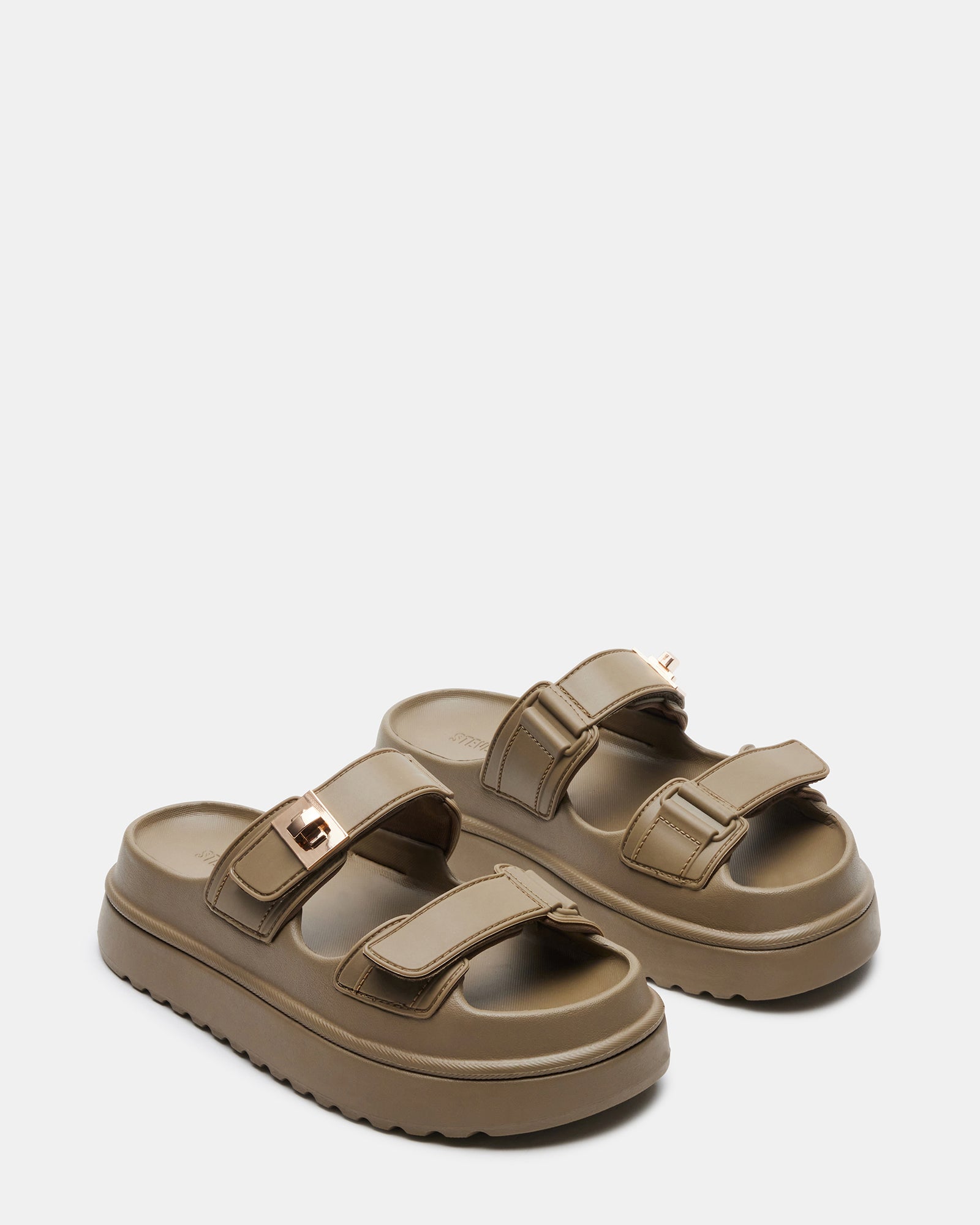 Outdoor lifestyle photo of platform sandals worn in urban summer setting