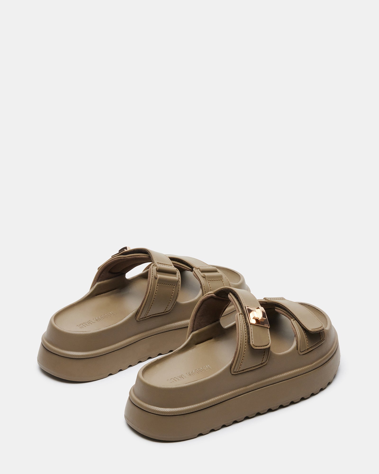 Outdoor lifestyle photo of platform sandals worn in urban summer setting