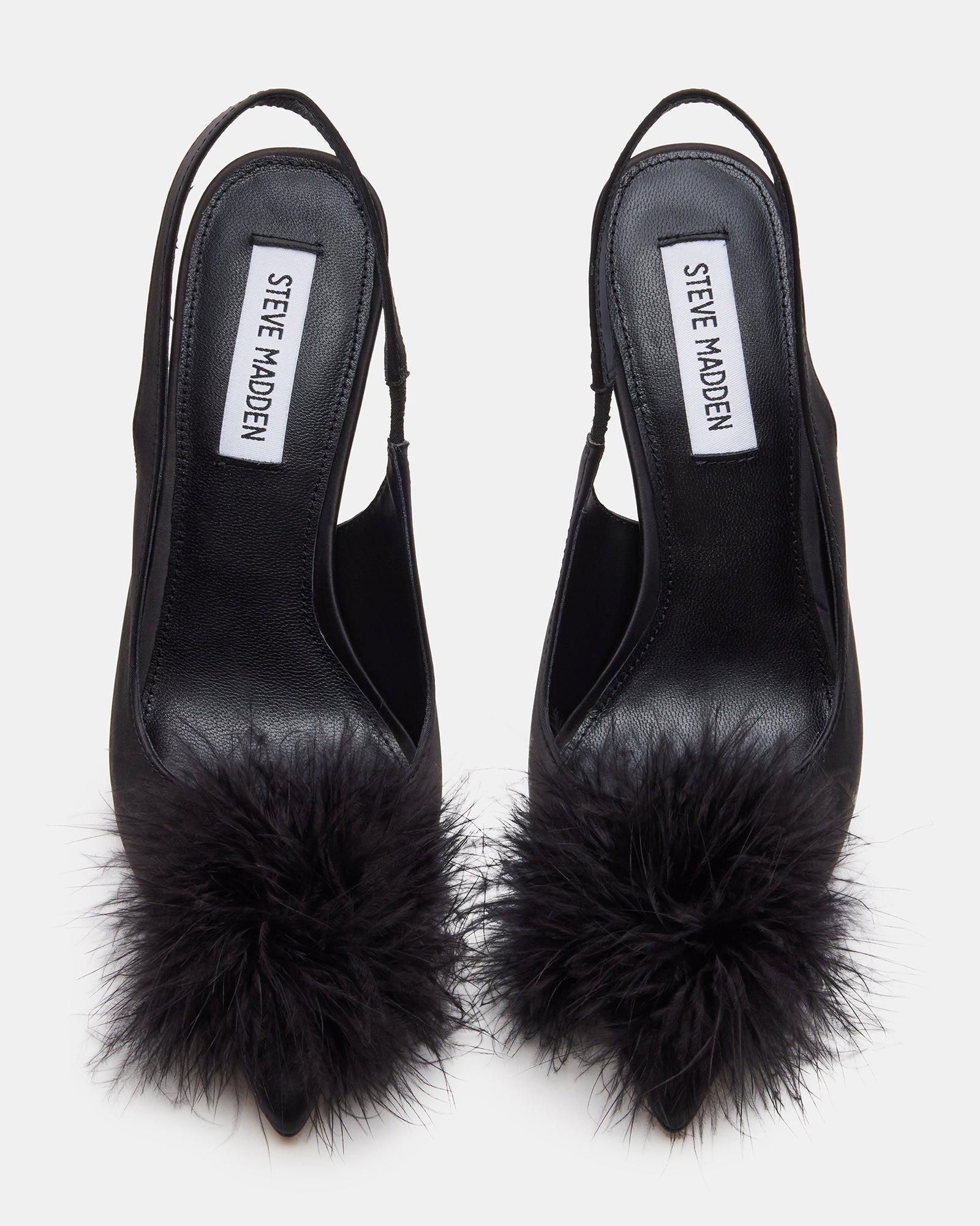 Side view of BLYTHE black slingback pumps with faux fur detail