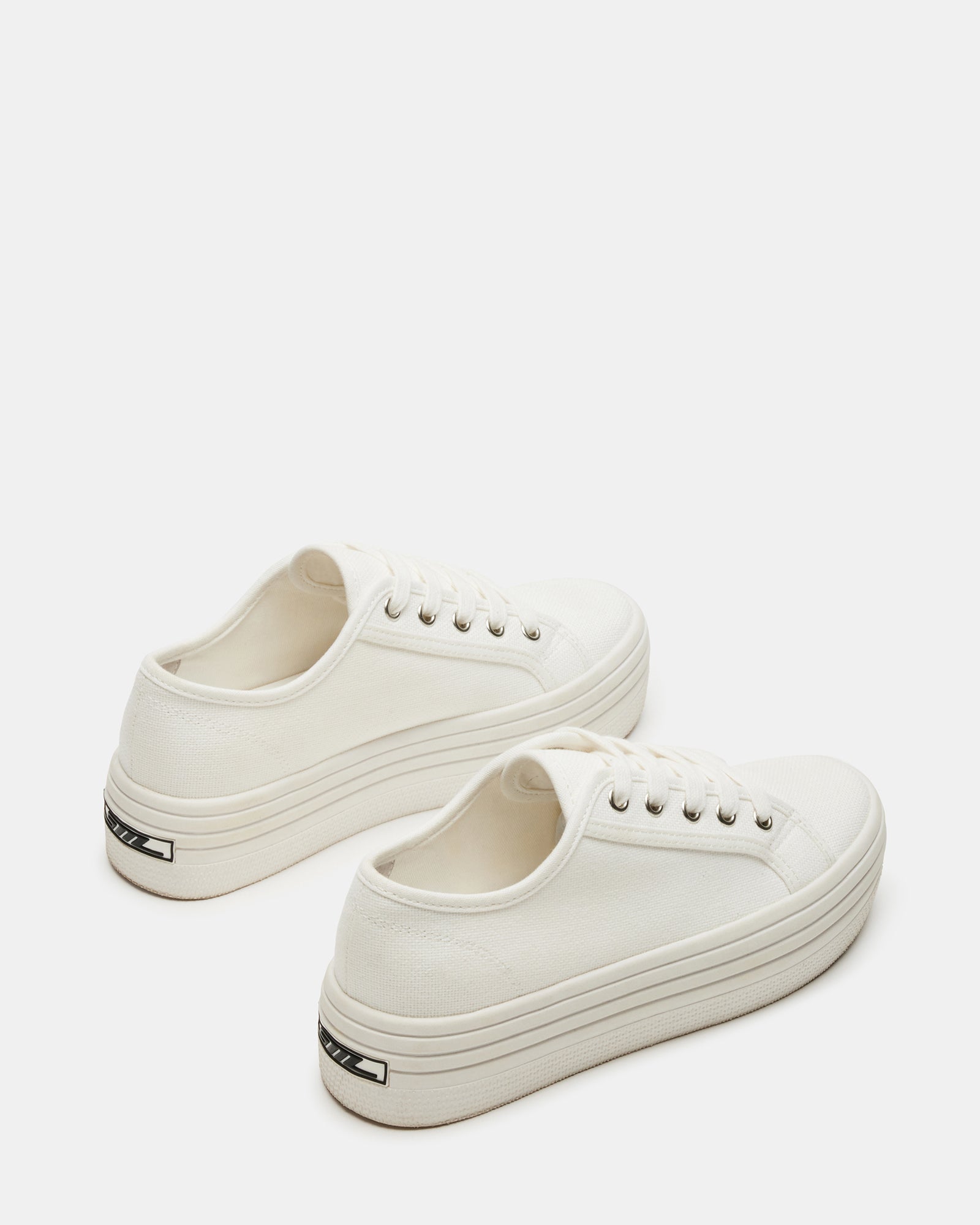 Bobbi 30 white platform sandals on a stylish background