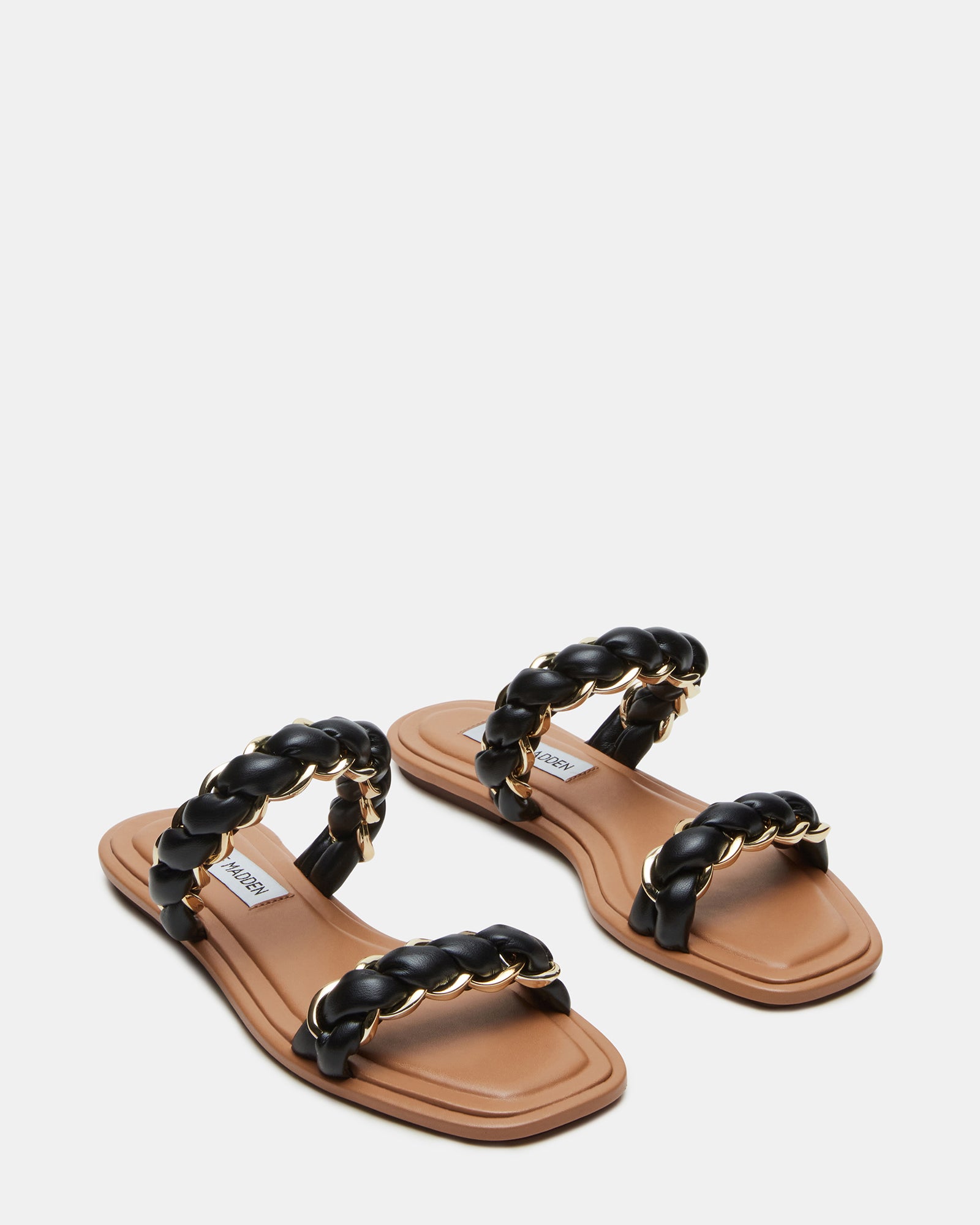 Overhead shot of black high heel slide sandals styled with summer attire