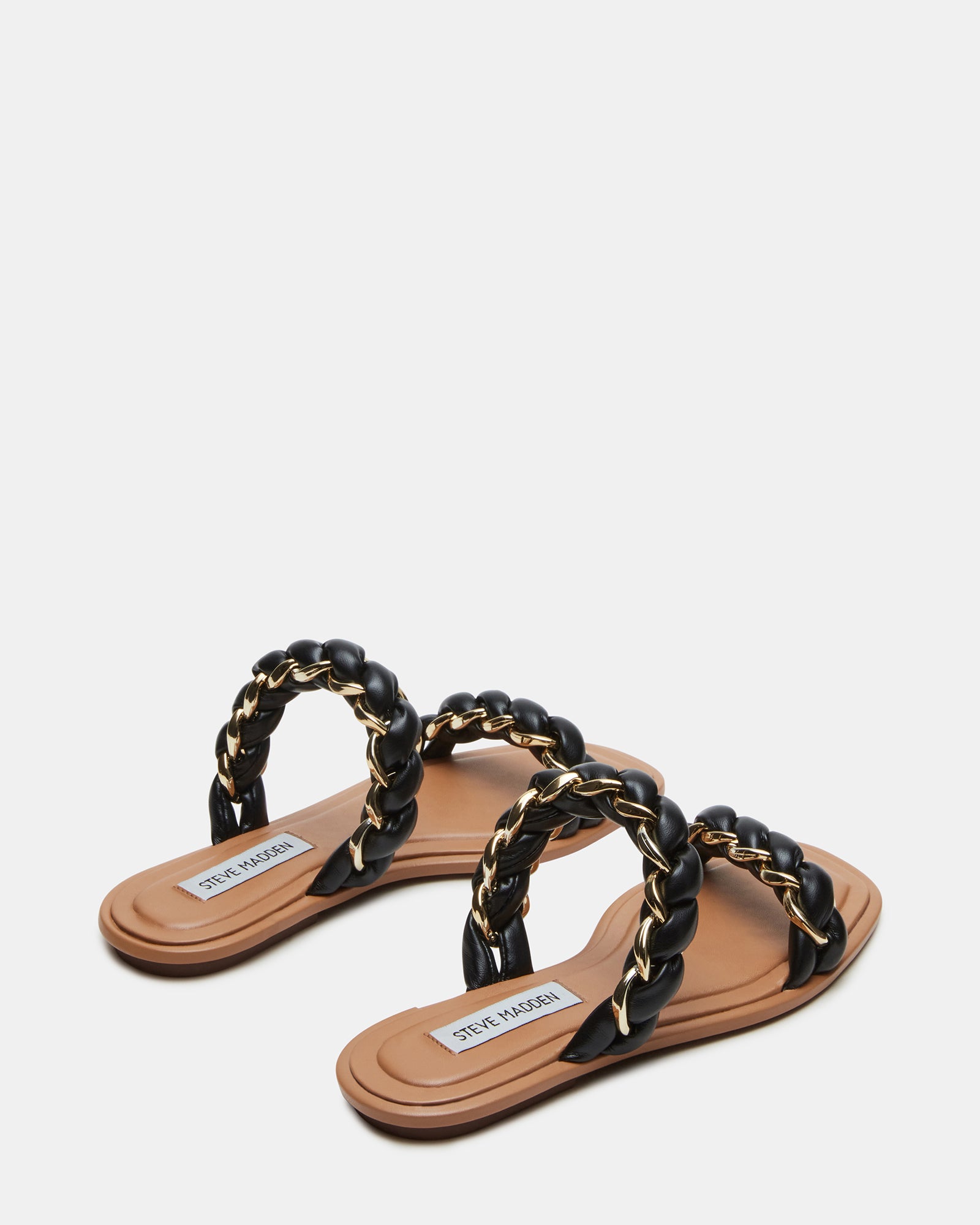Overhead shot of black high heel slide sandals styled with summer attire