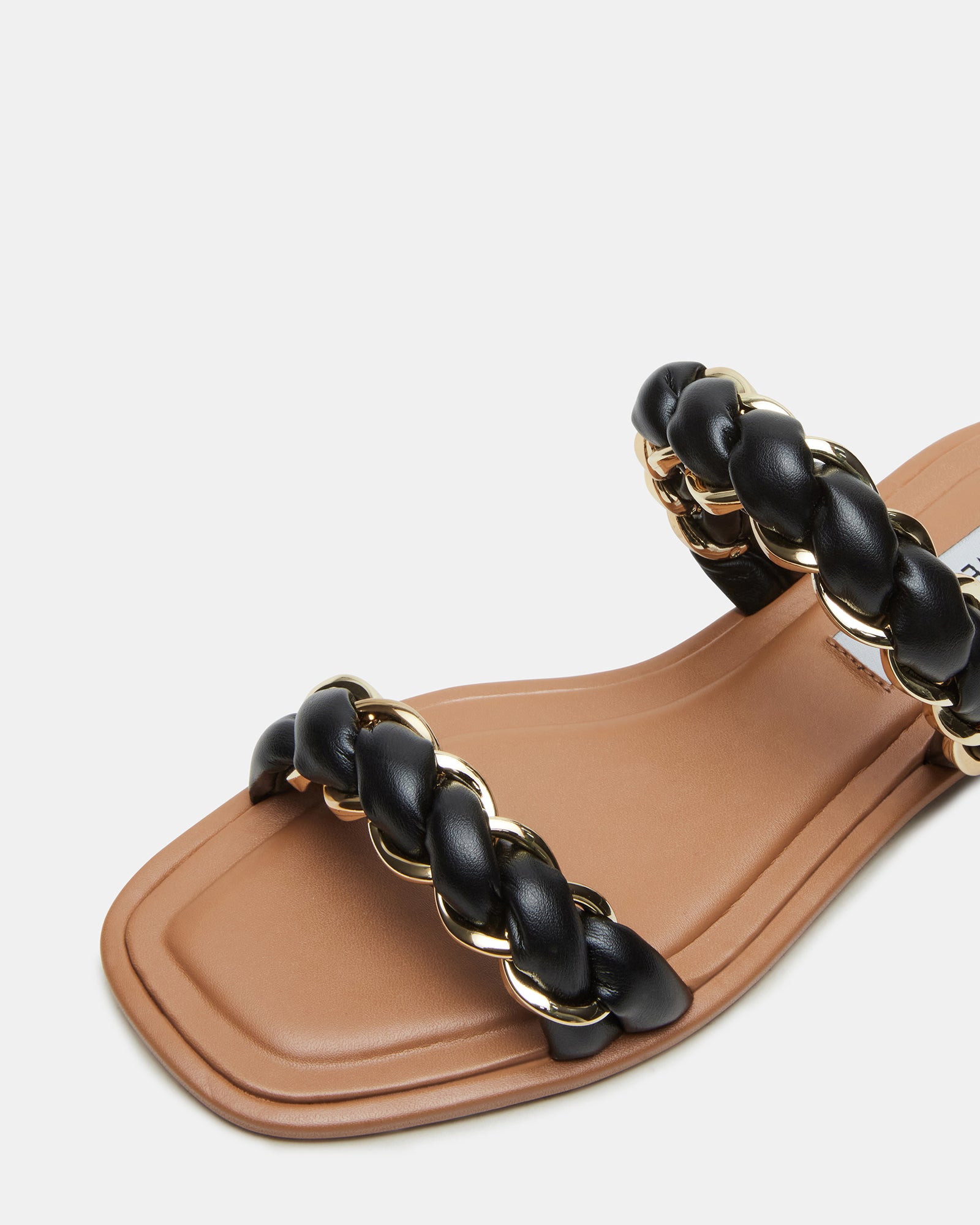 Close-up of boho sandals showcasing braided texture and sleek silhouette