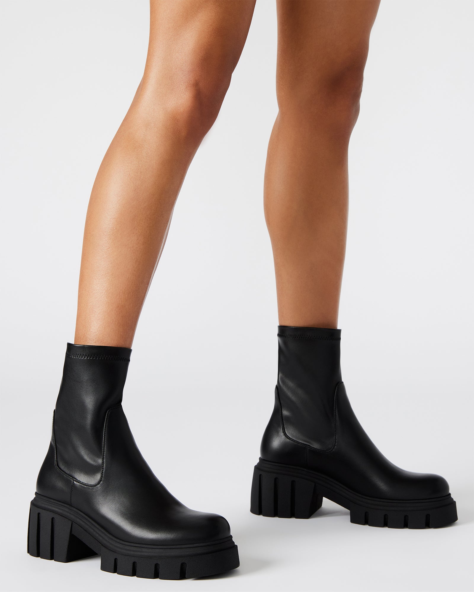 Close-up shot of platform bootie heel and vegan leather texture