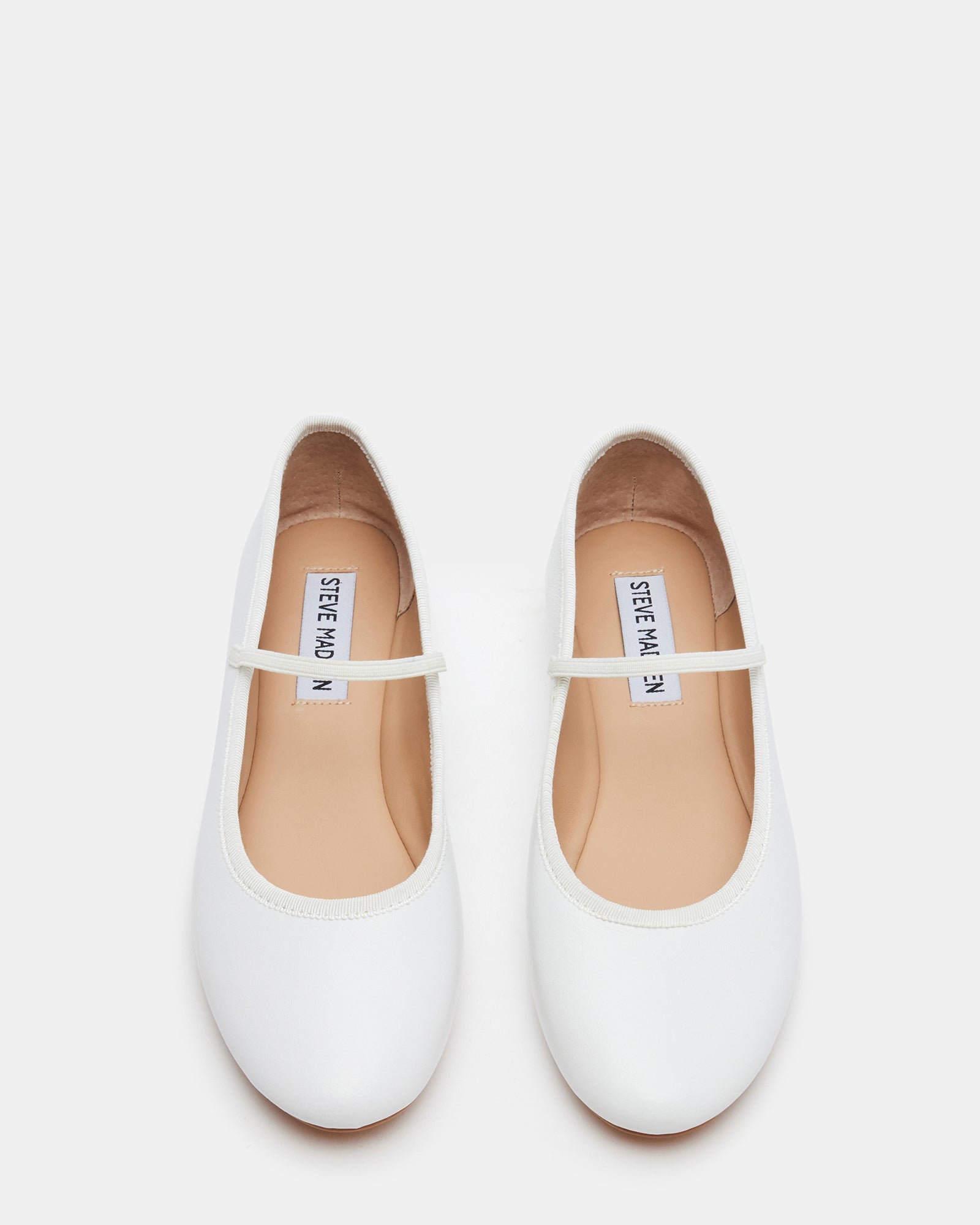 Close-up of the elastic strap on the white leather flats, perfect for casual outings.
