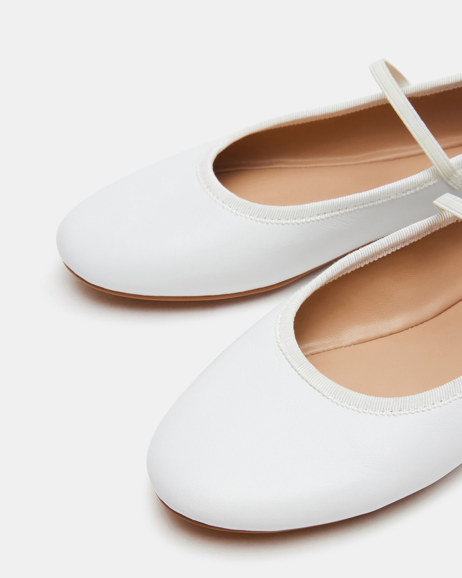 Bouquet white ballet flats showcasing the elegant design from the side.