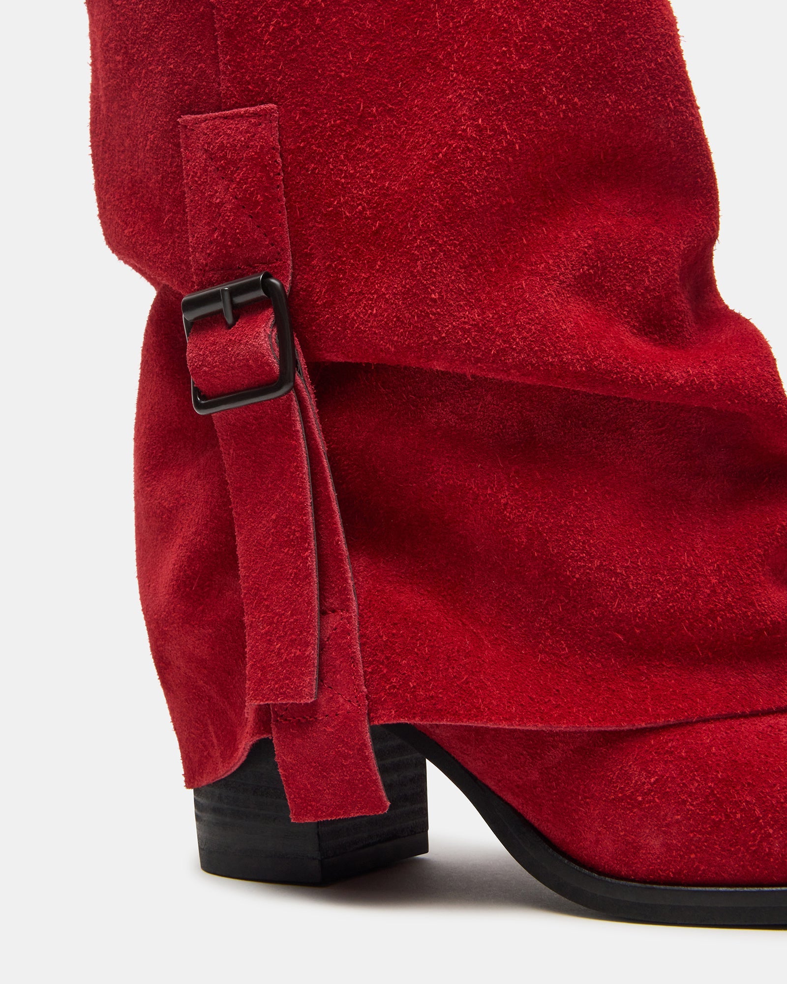 Outdoor shot of fashionable snow boots for women paired with winter attire.