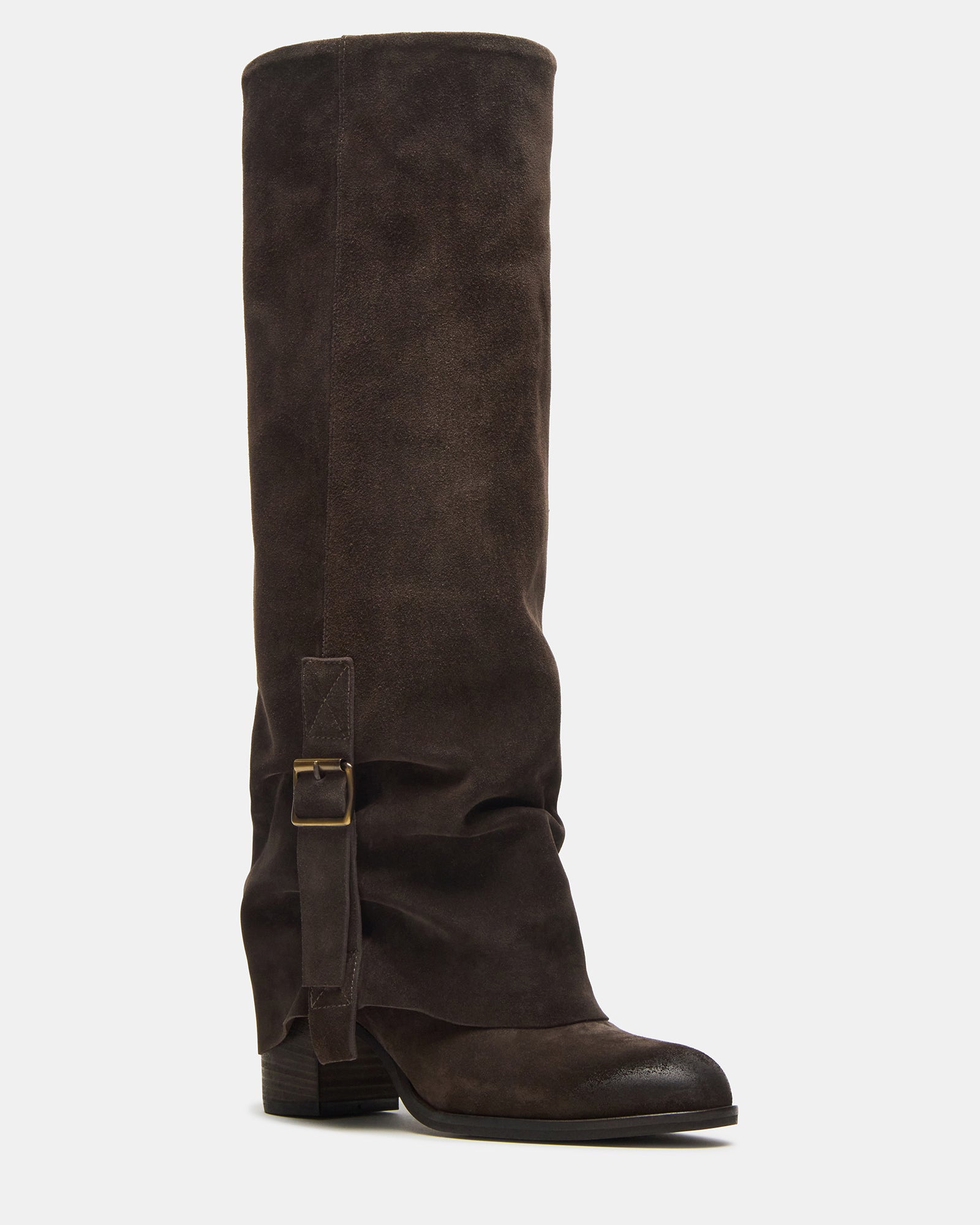 Fold-over boots displayed upright against rustic wood, perfect for wide calves.