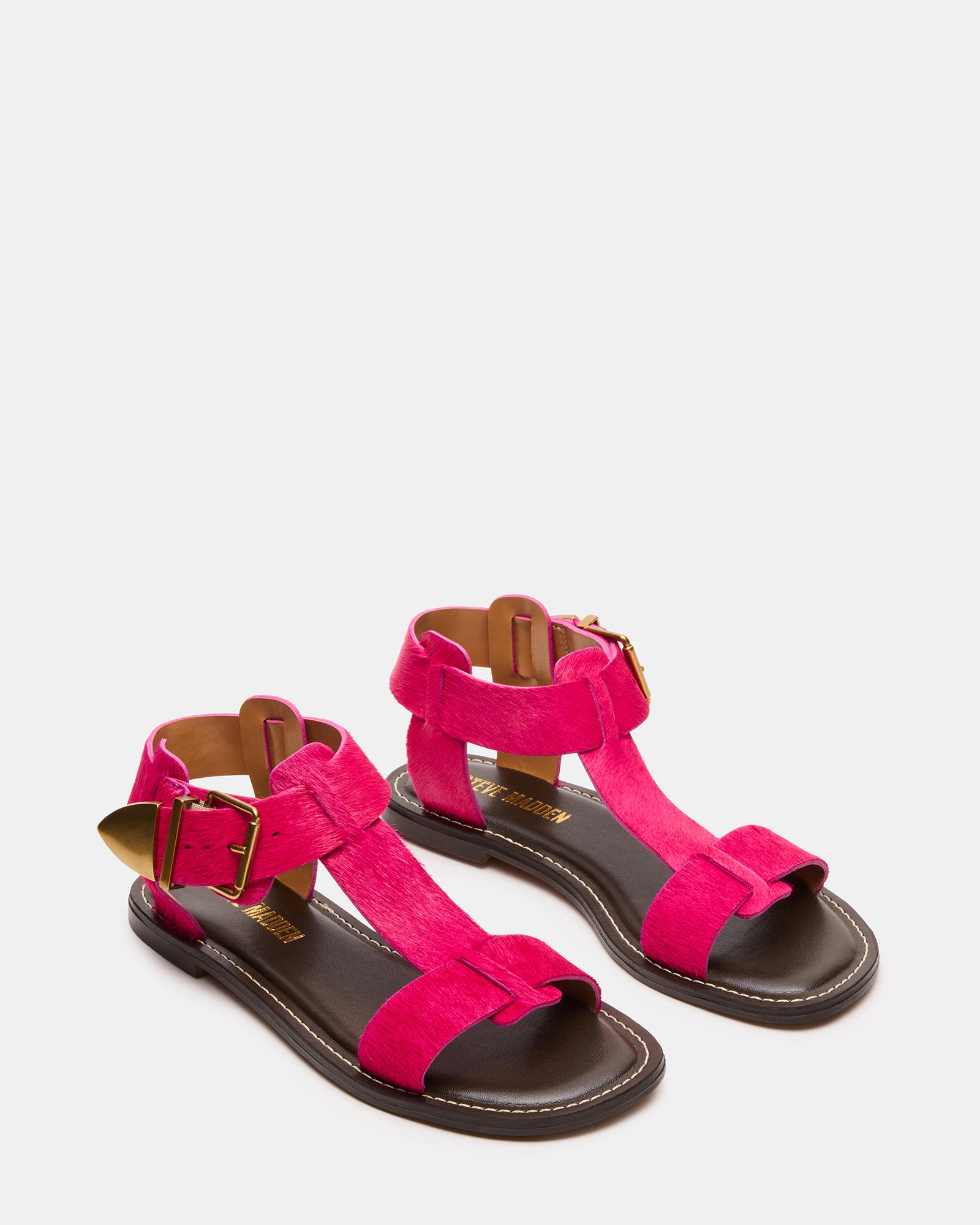 Close-up view of the strappy design and leather material of the flat sandals