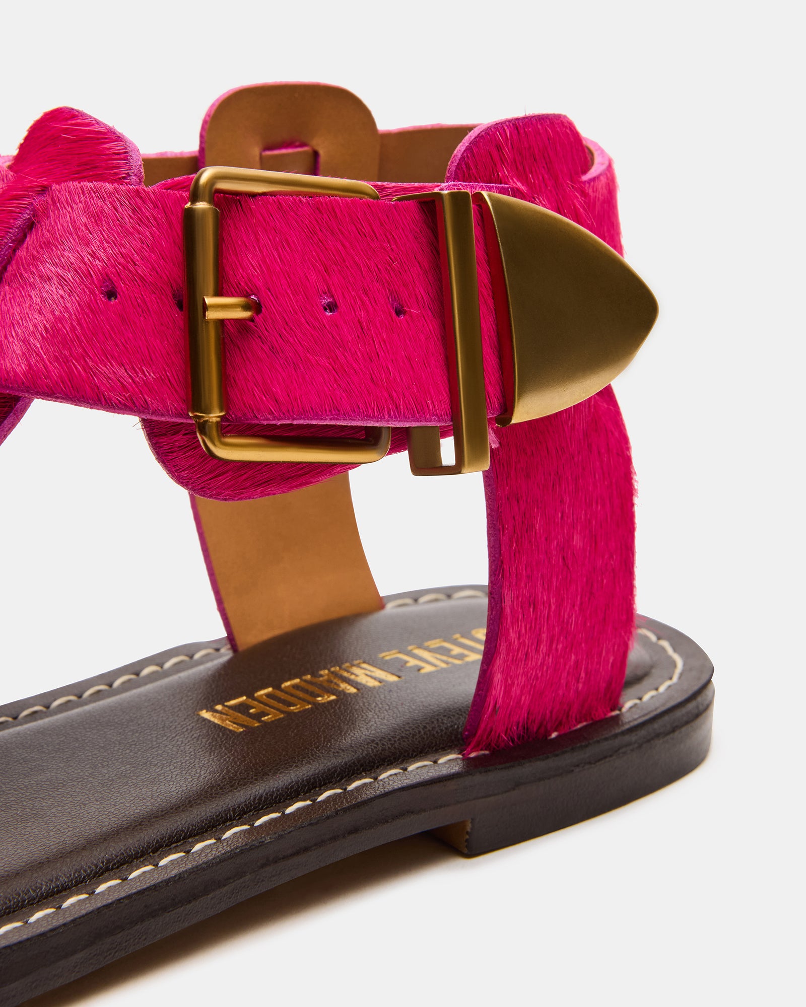 Side angle of the BRAZINN flat sandals highlighting the 0.5-inch heel and ankle strap