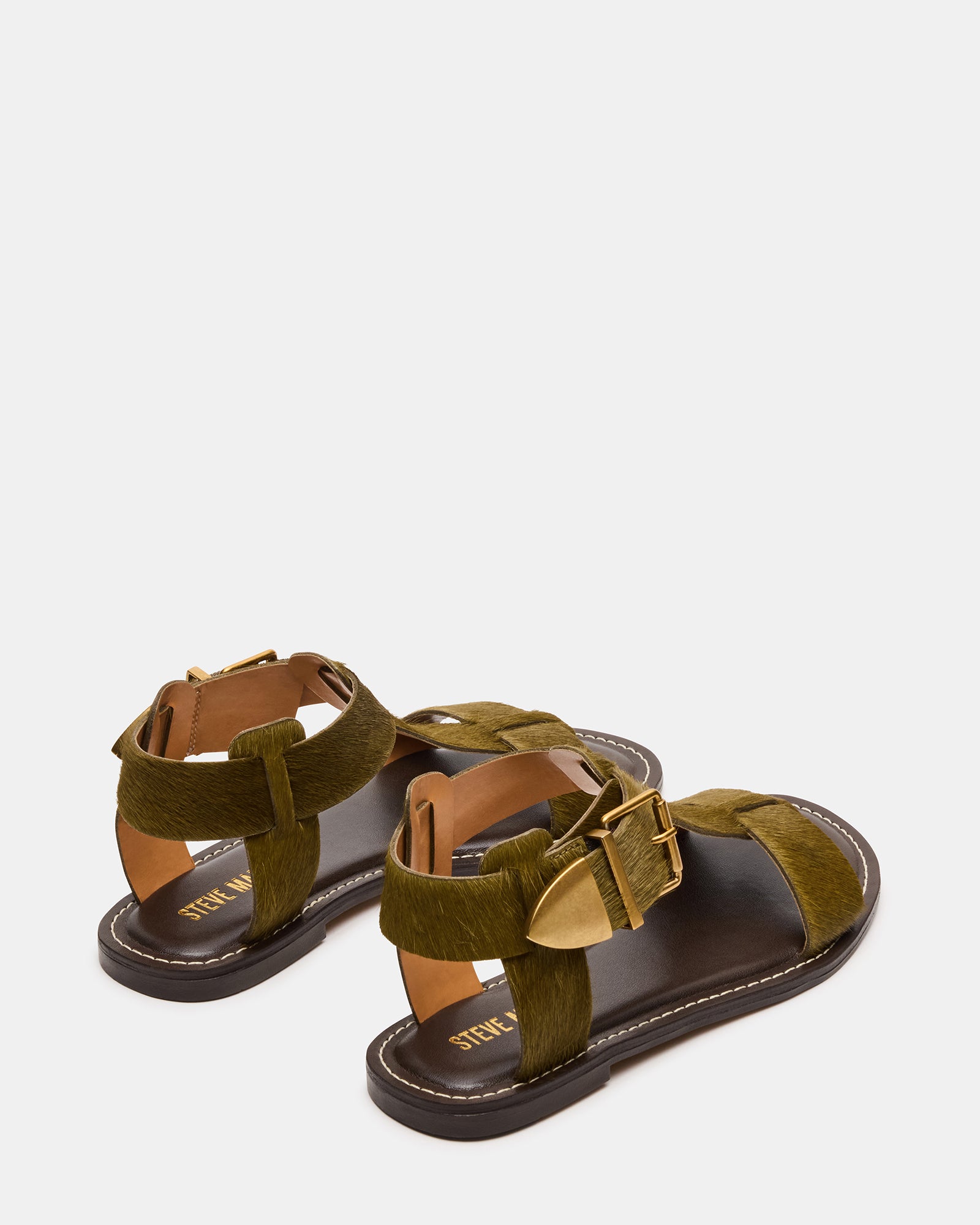Close-up of ankle strap and leather detailing on the BRAZINN sandal.
