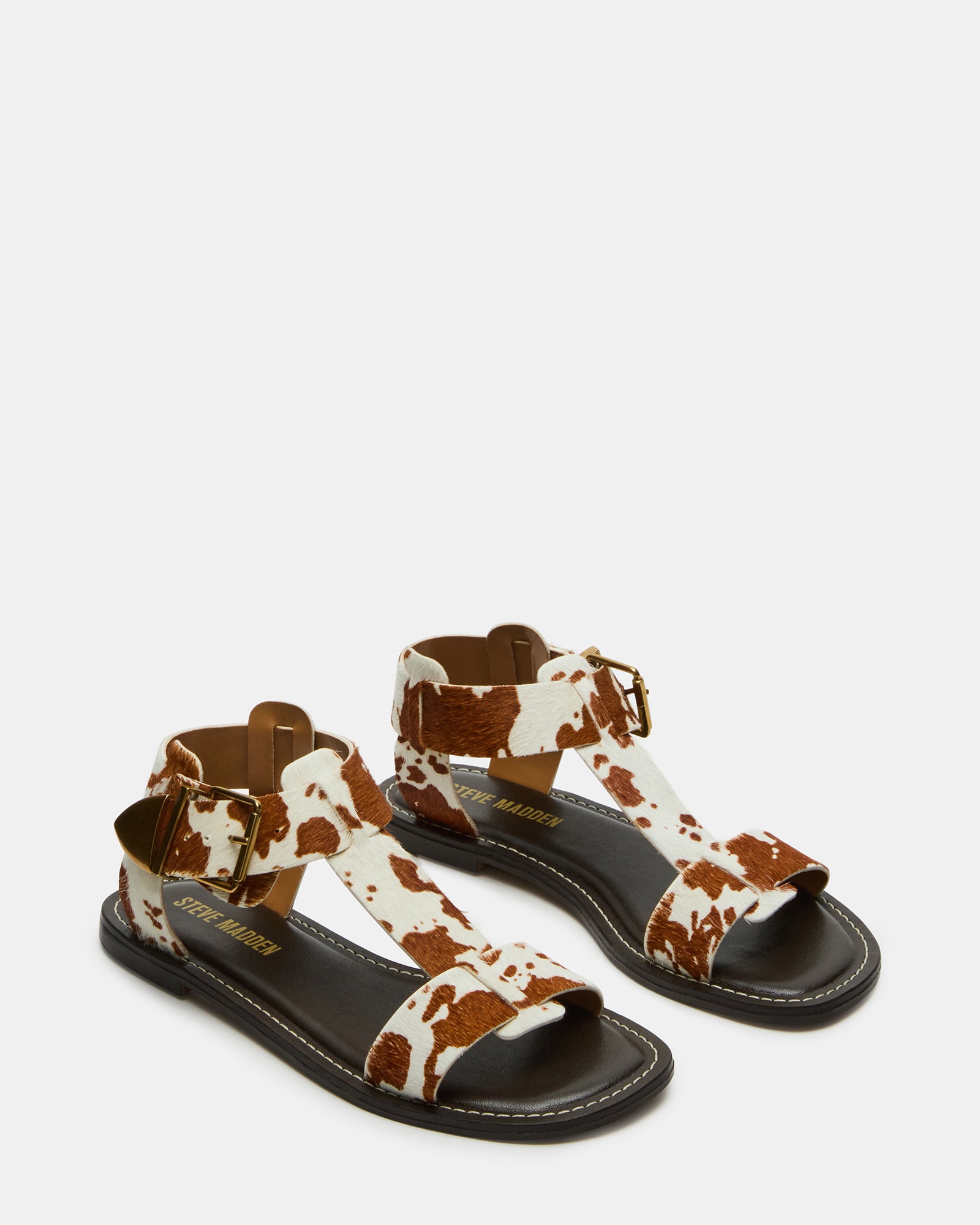 Stylish strappy design of the Braziin flat sandals in natural light.