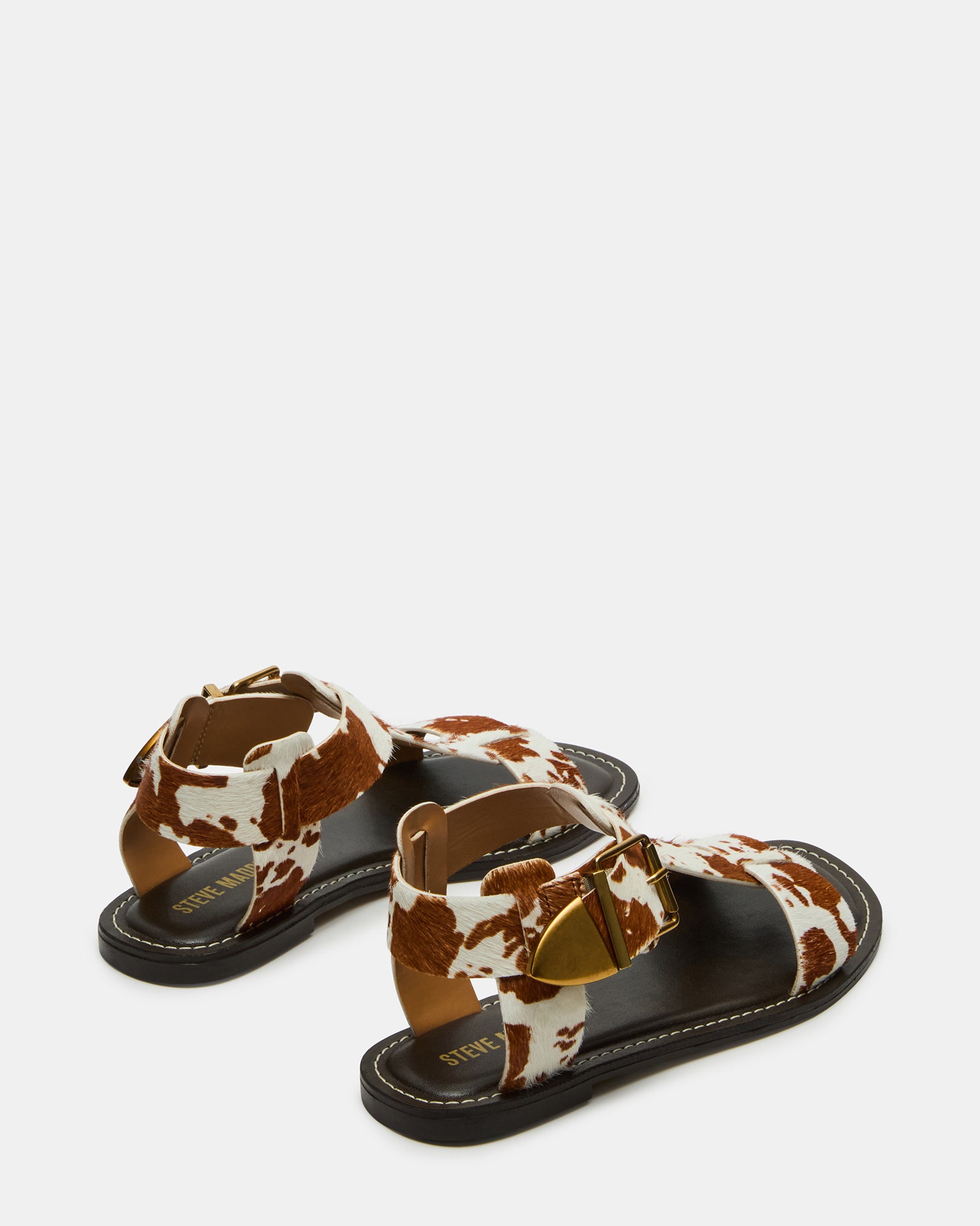 Stylish strappy design of the Braziin flat sandals in natural light.