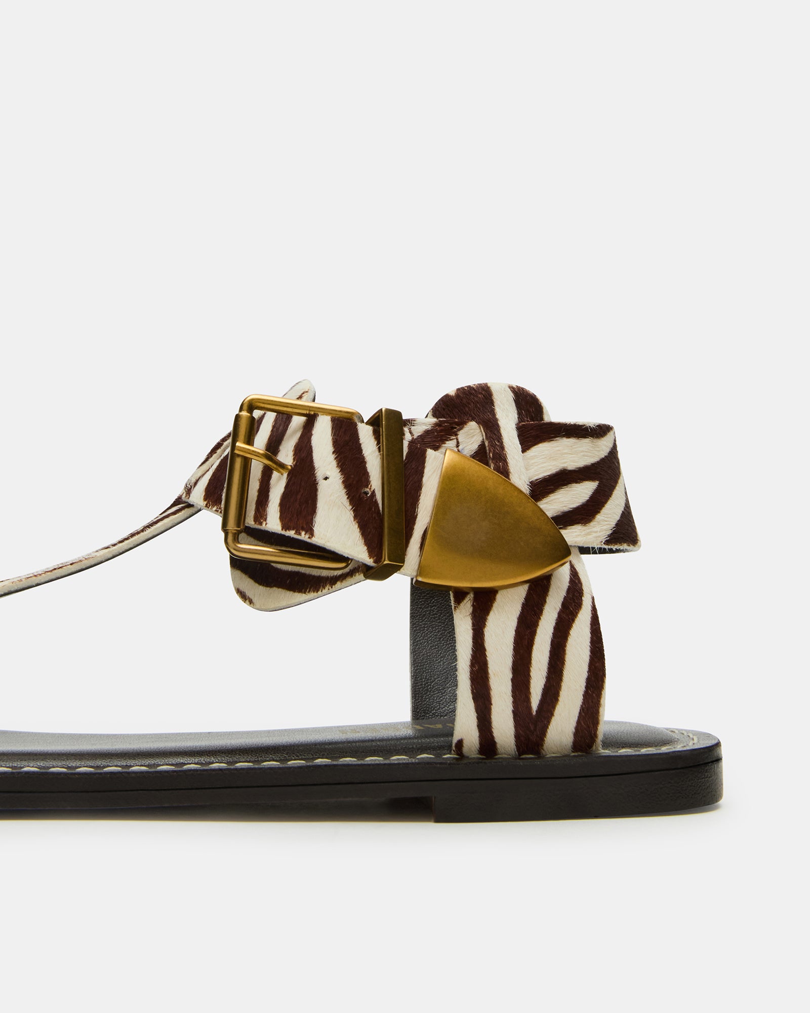 Close-up of the comfortable synthetic sole and leather upper of BRAZINN zebra sandals