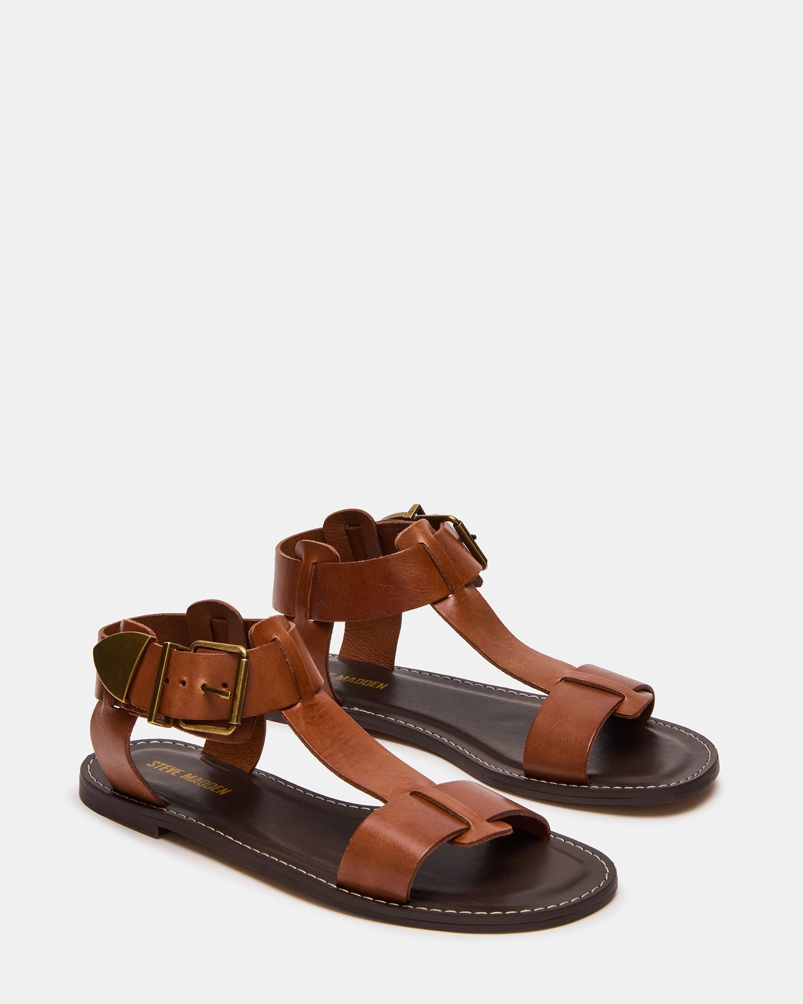 Fashionable leather flat sandals worn with casual summer outfits