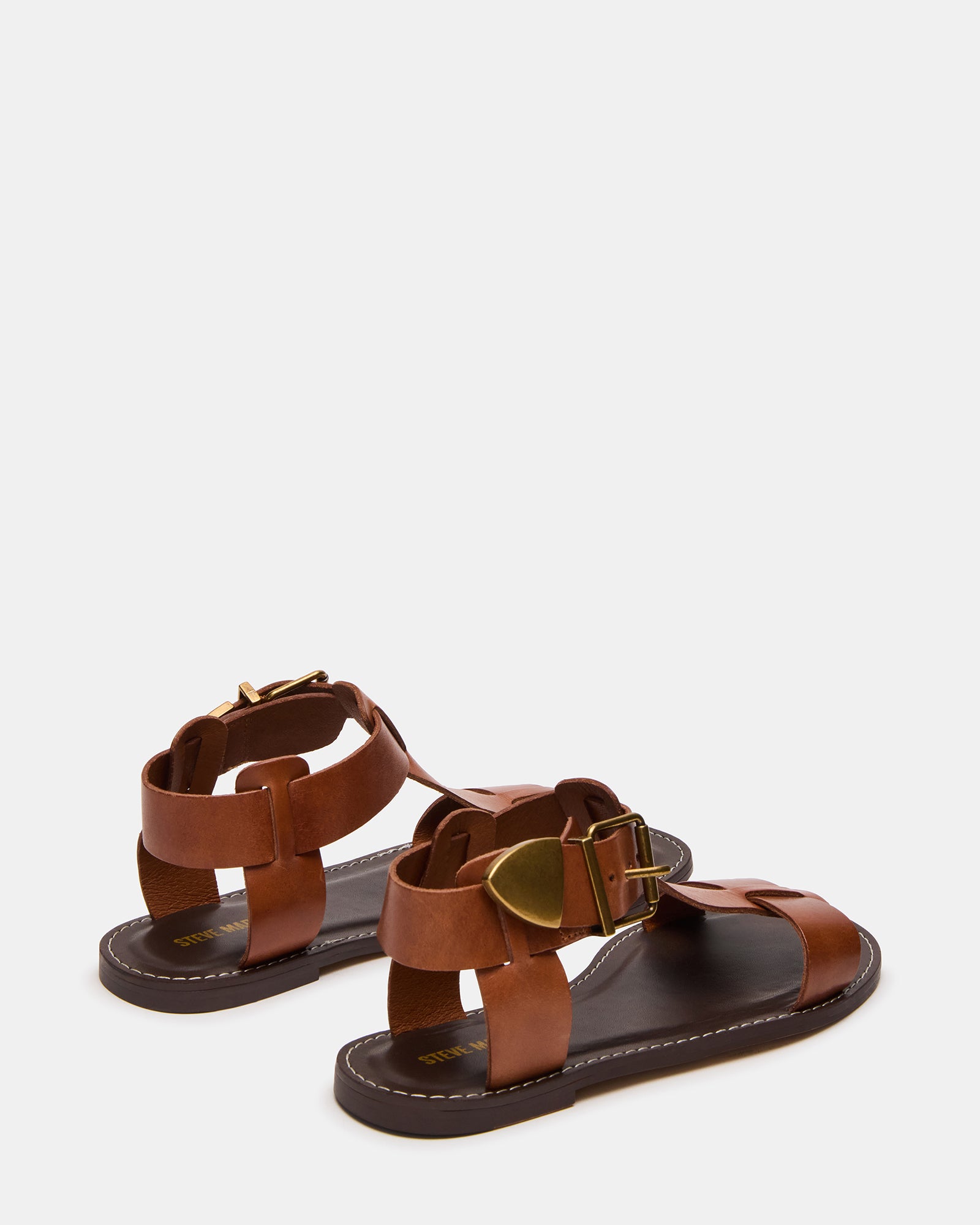 Fashionable leather flat sandals worn with casual summer outfits