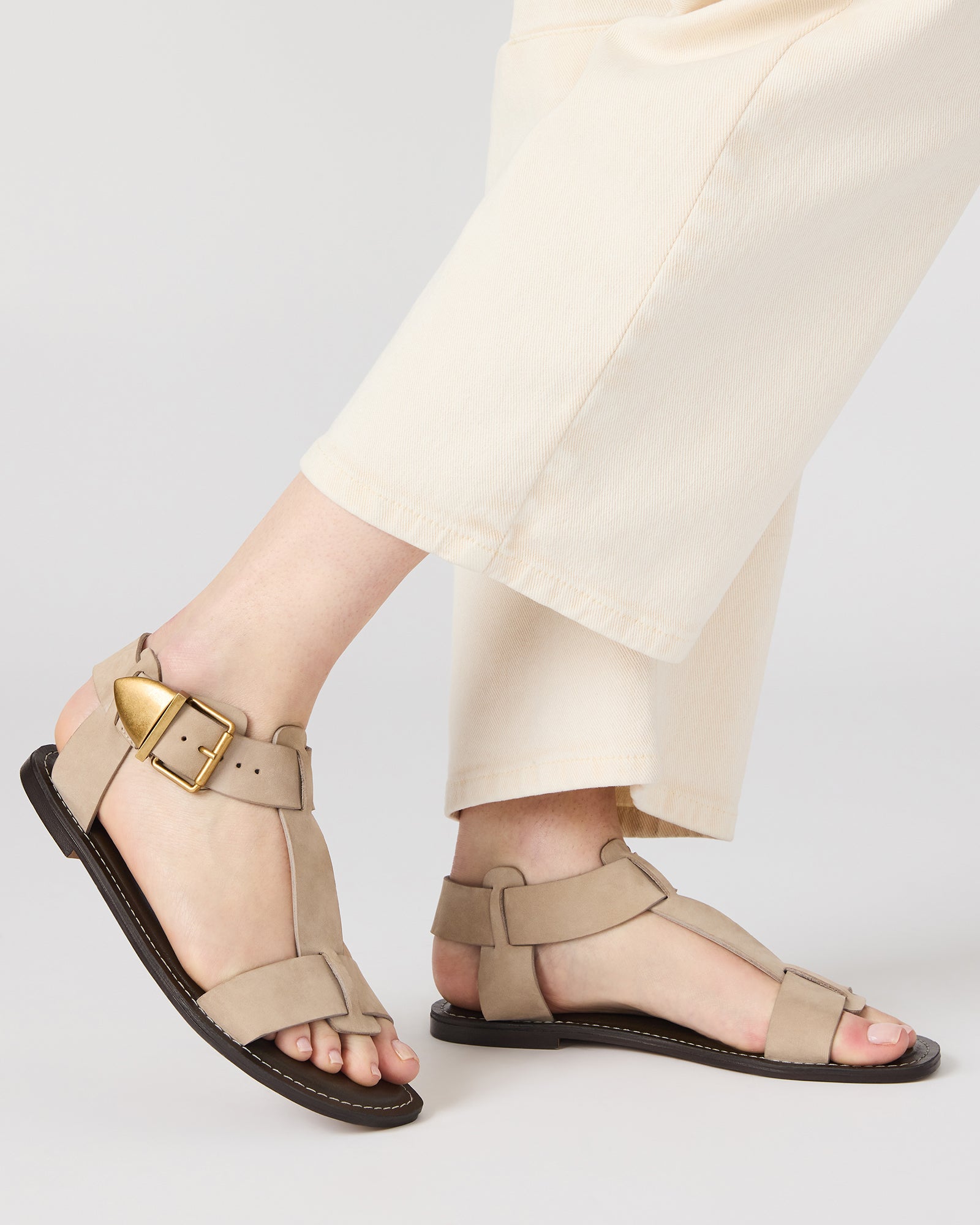 Side view of stylish flat sandals for women with strappy design