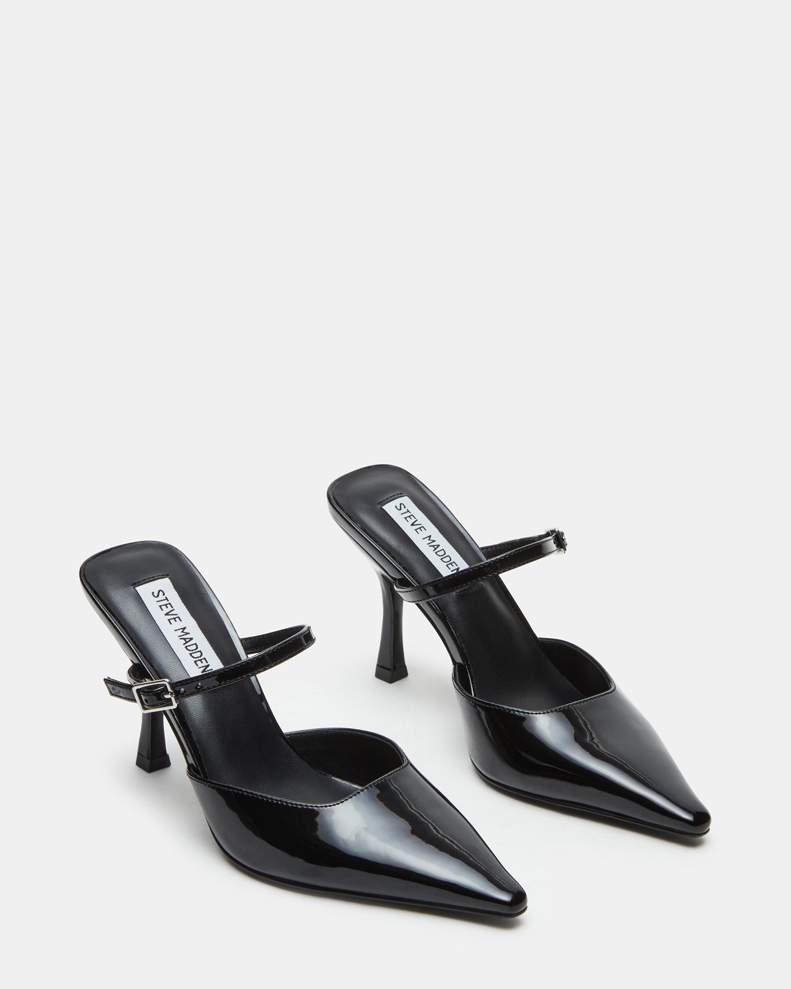 Model wearing Brecki Luxe mules styled for a chic evening look.