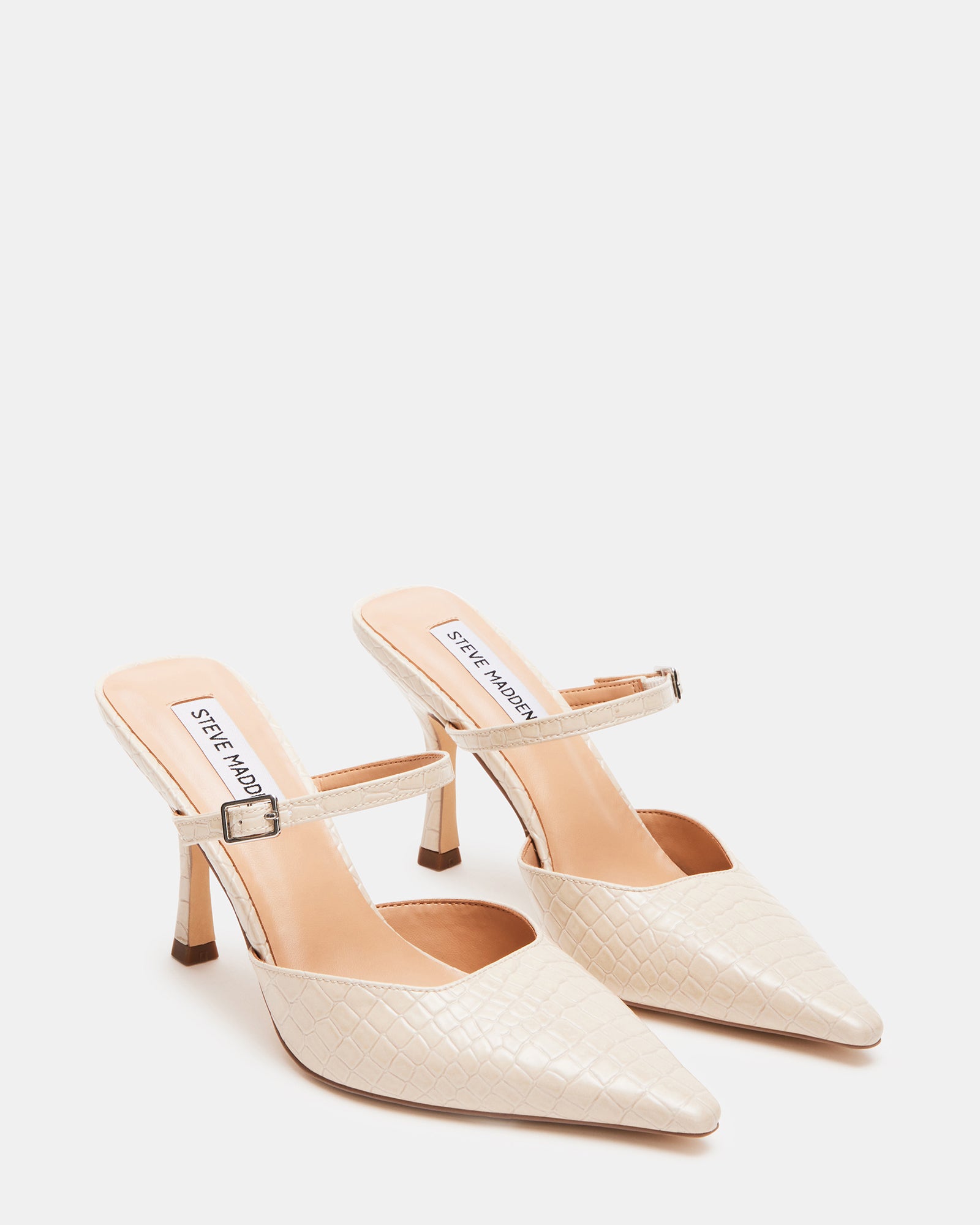Close-up of pointed toe block heel pumps designed for sophisticated elegance.