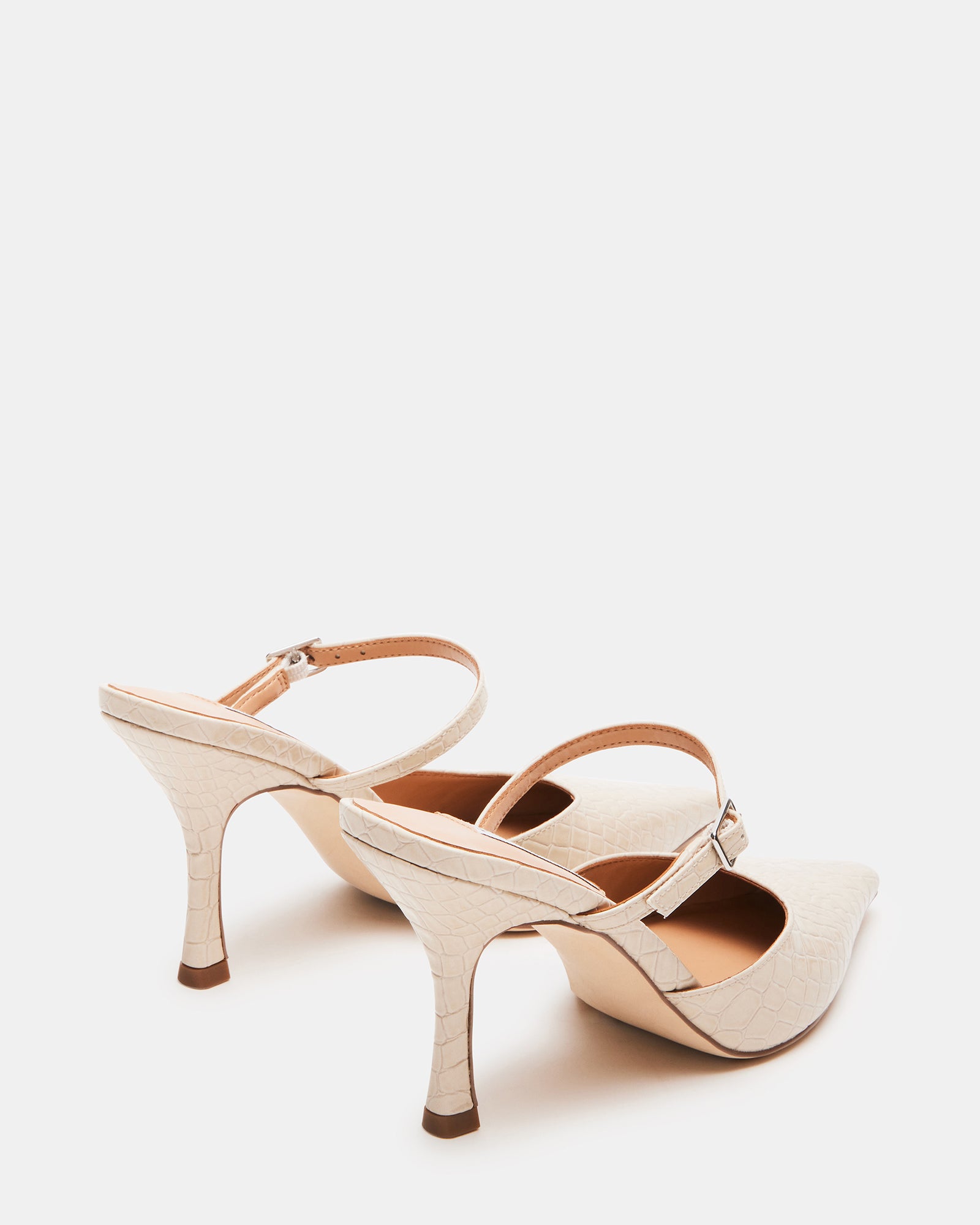 Close-up of pointed toe block heel pumps designed for sophisticated elegance.