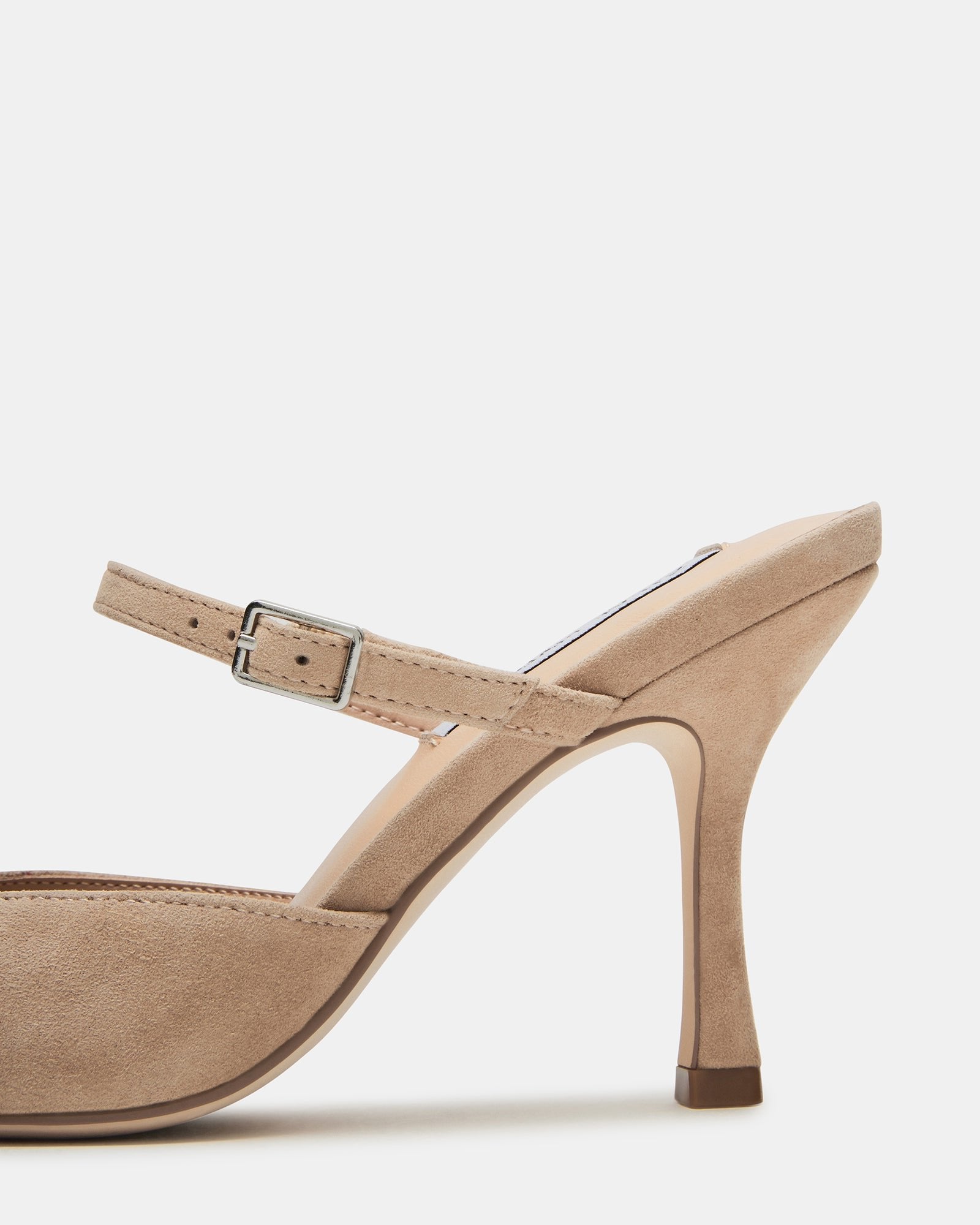 Taupe suede kitten heel mules paired with cropped jeans for casual elegance