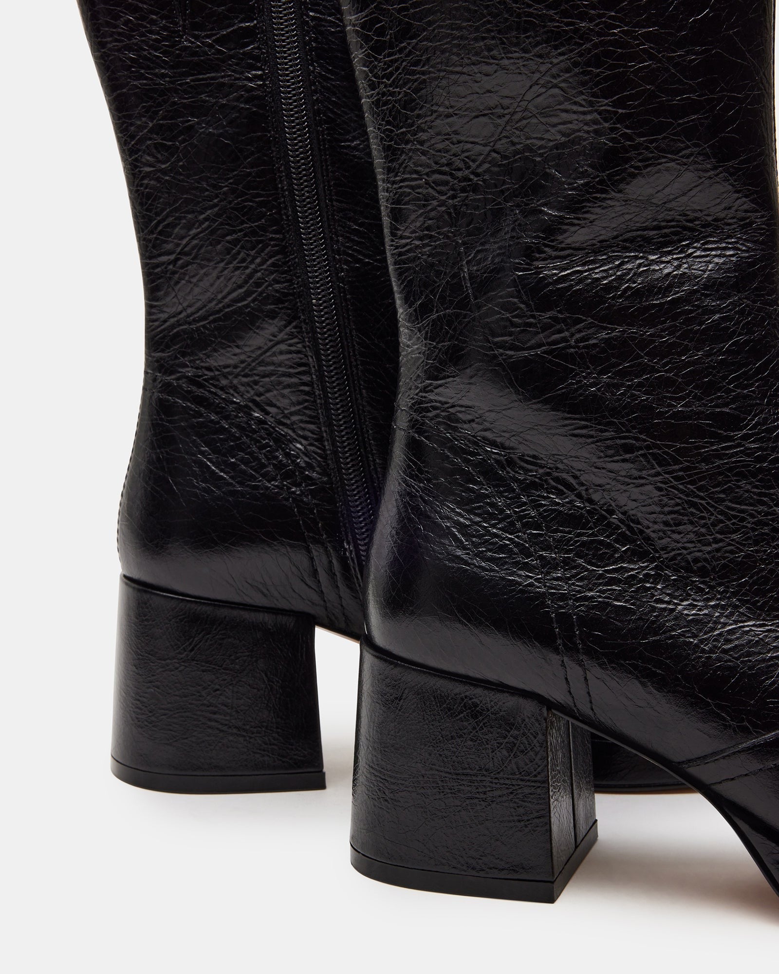 Model wearing Brentwood black leather ankle booties paired with casual outfit
