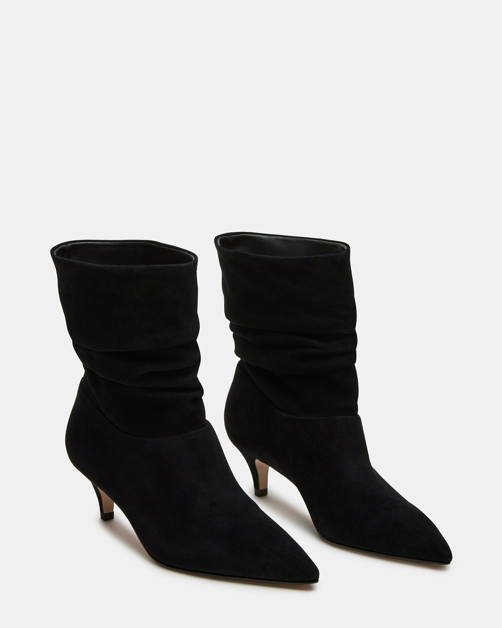 Outfit pairing featuring black over-the-knee suede boots with a leather jacket