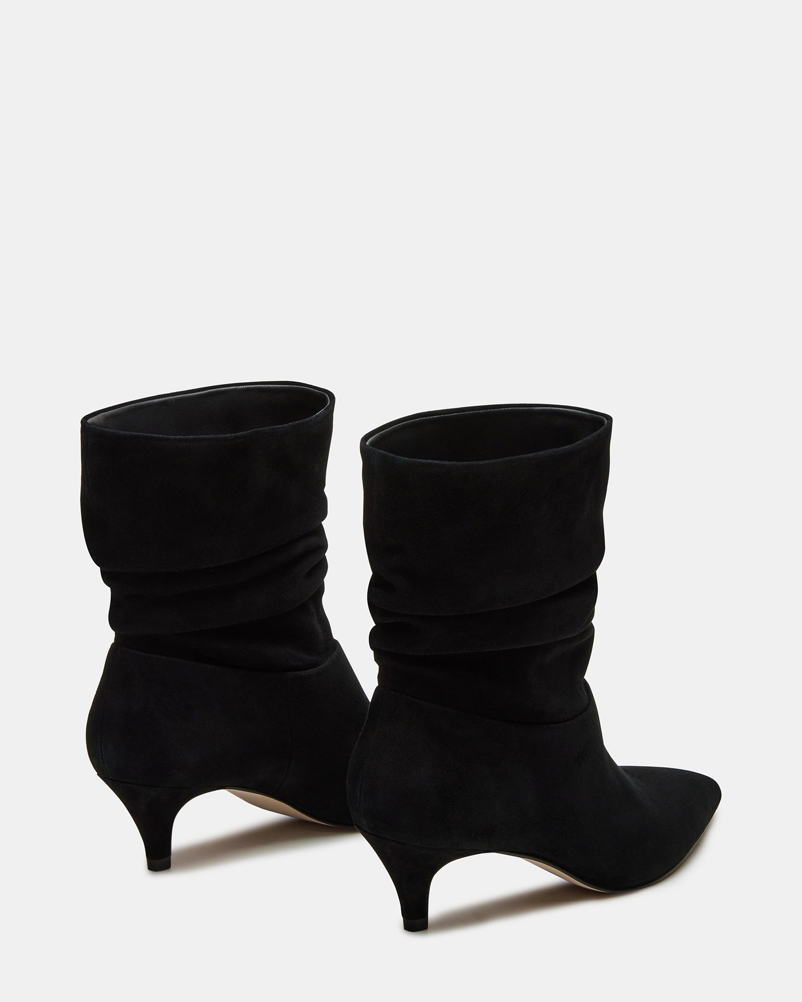 Outfit pairing featuring black over-the-knee suede boots with a leather jacket