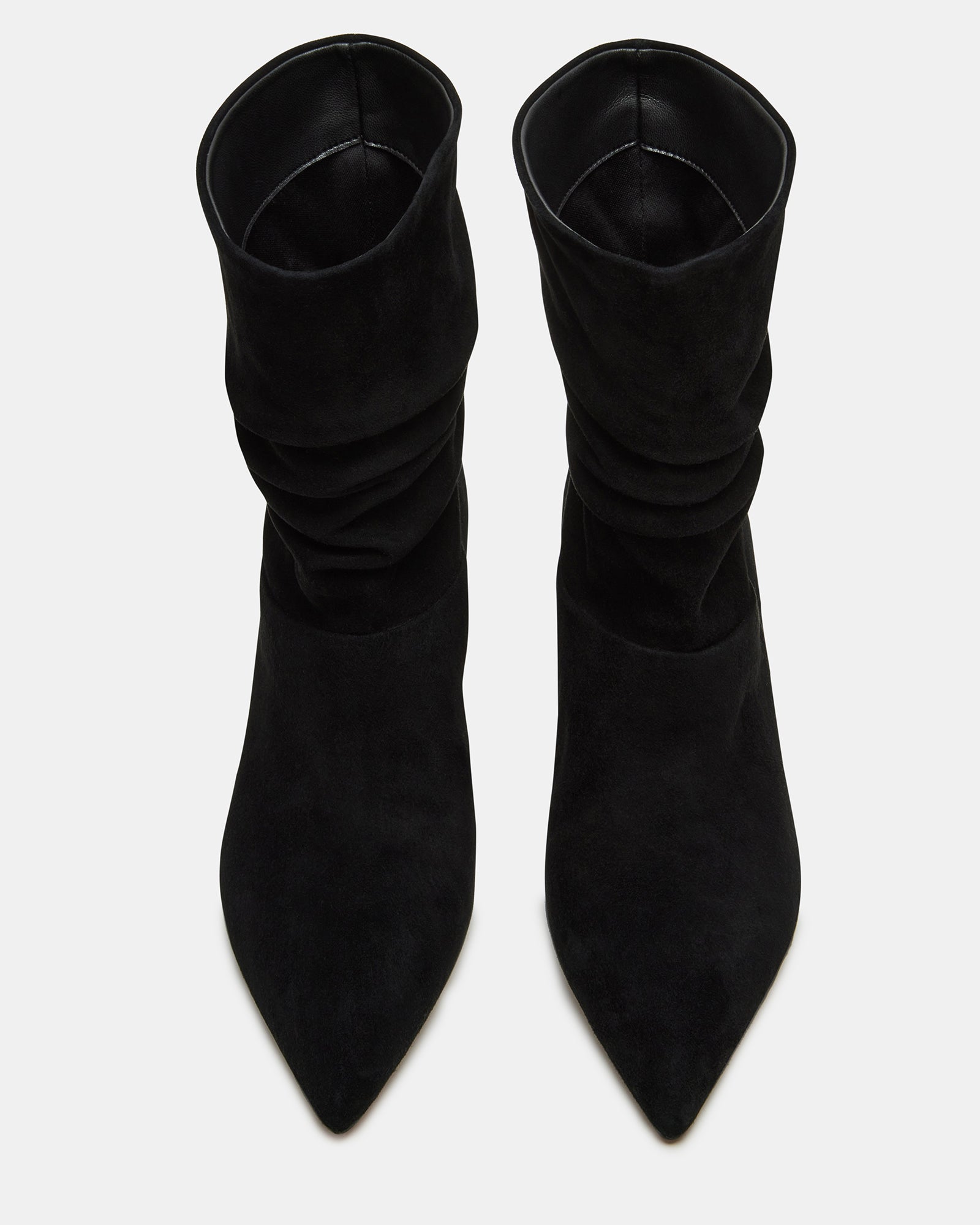 Close-up of the textured black suede material and kitten heel