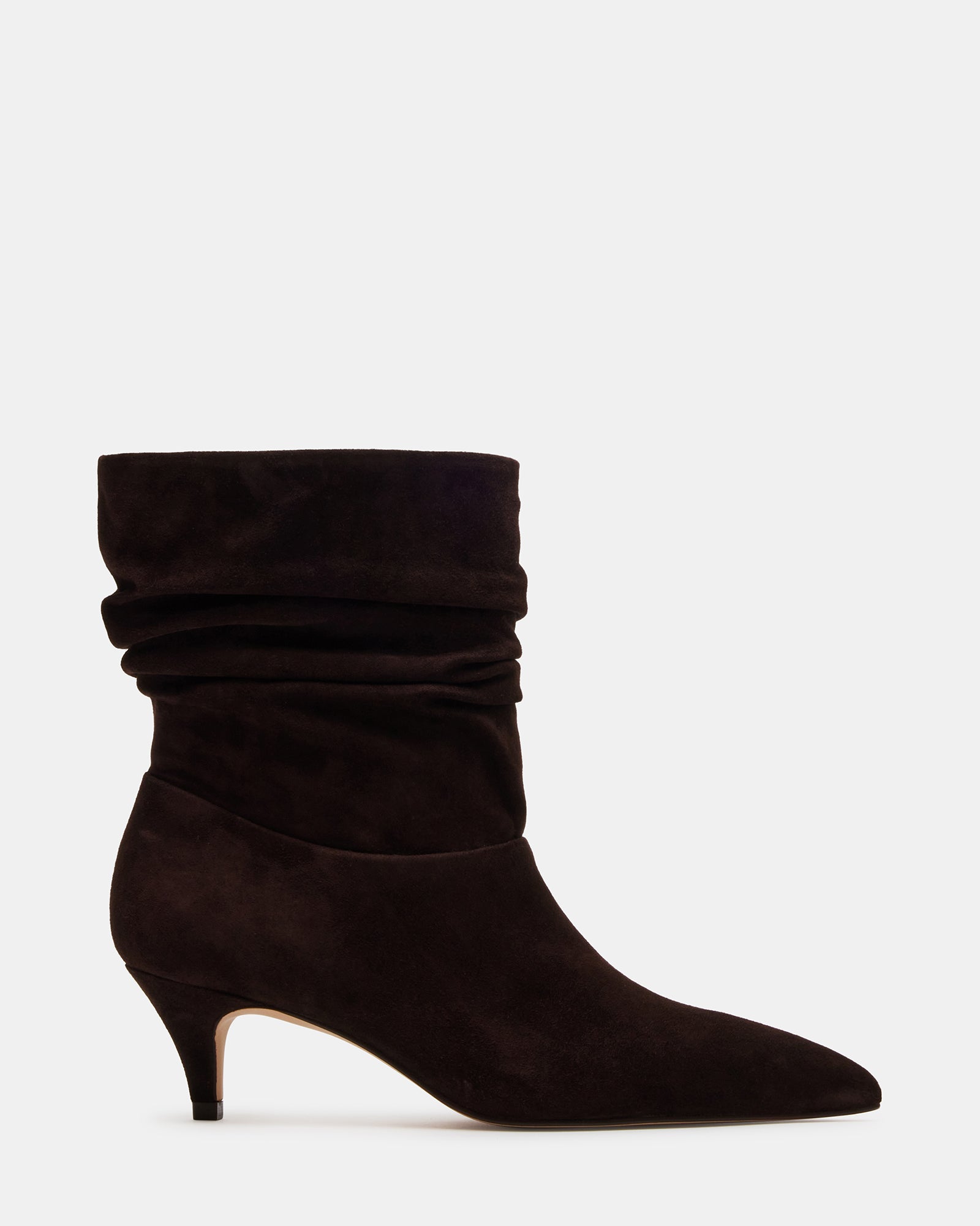 Side view of brown kitten heel boots styled with cropped jeans in downtown NYC