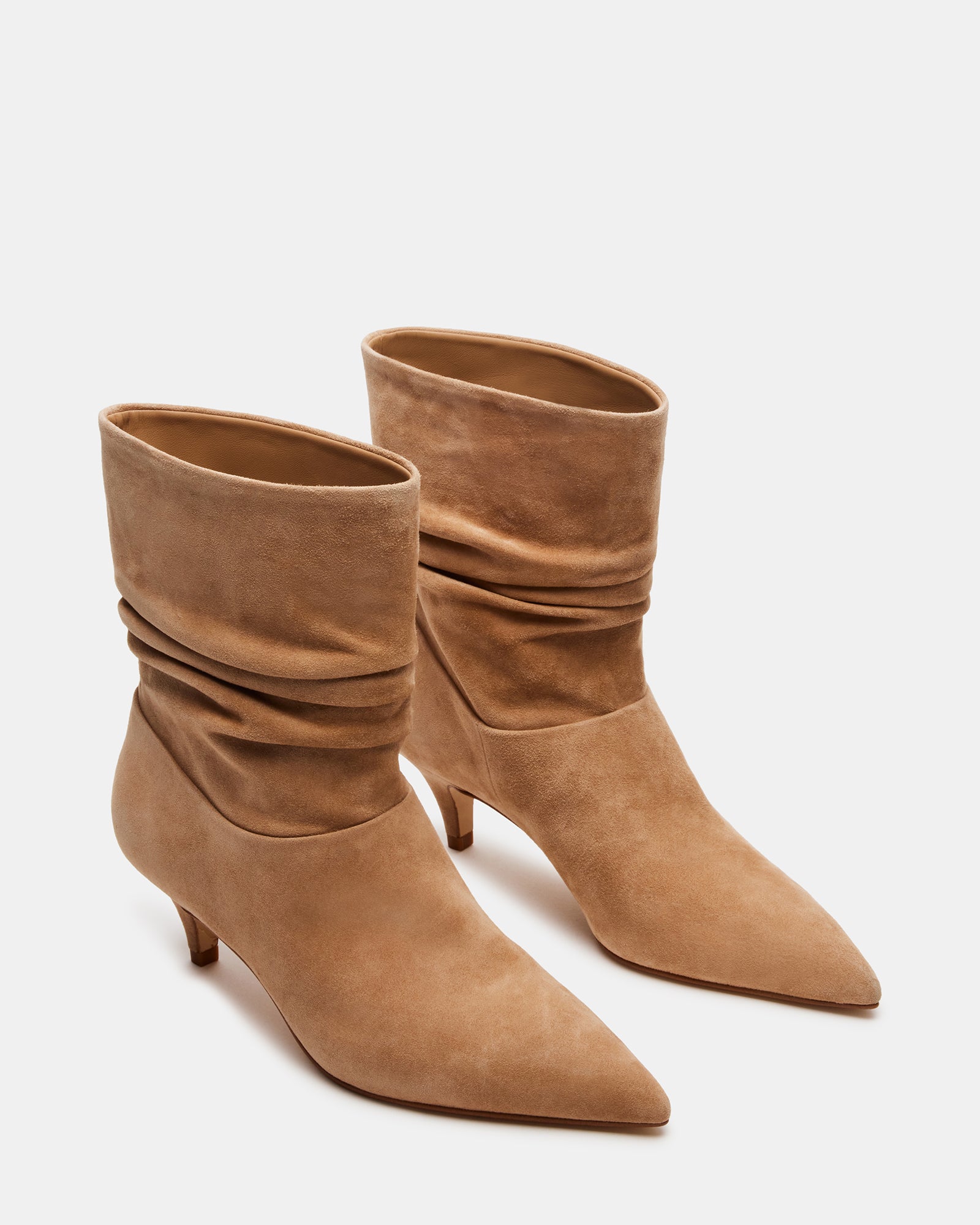 Side view of black ankle boots with a trendy kitten heel, perfect for casual outings.