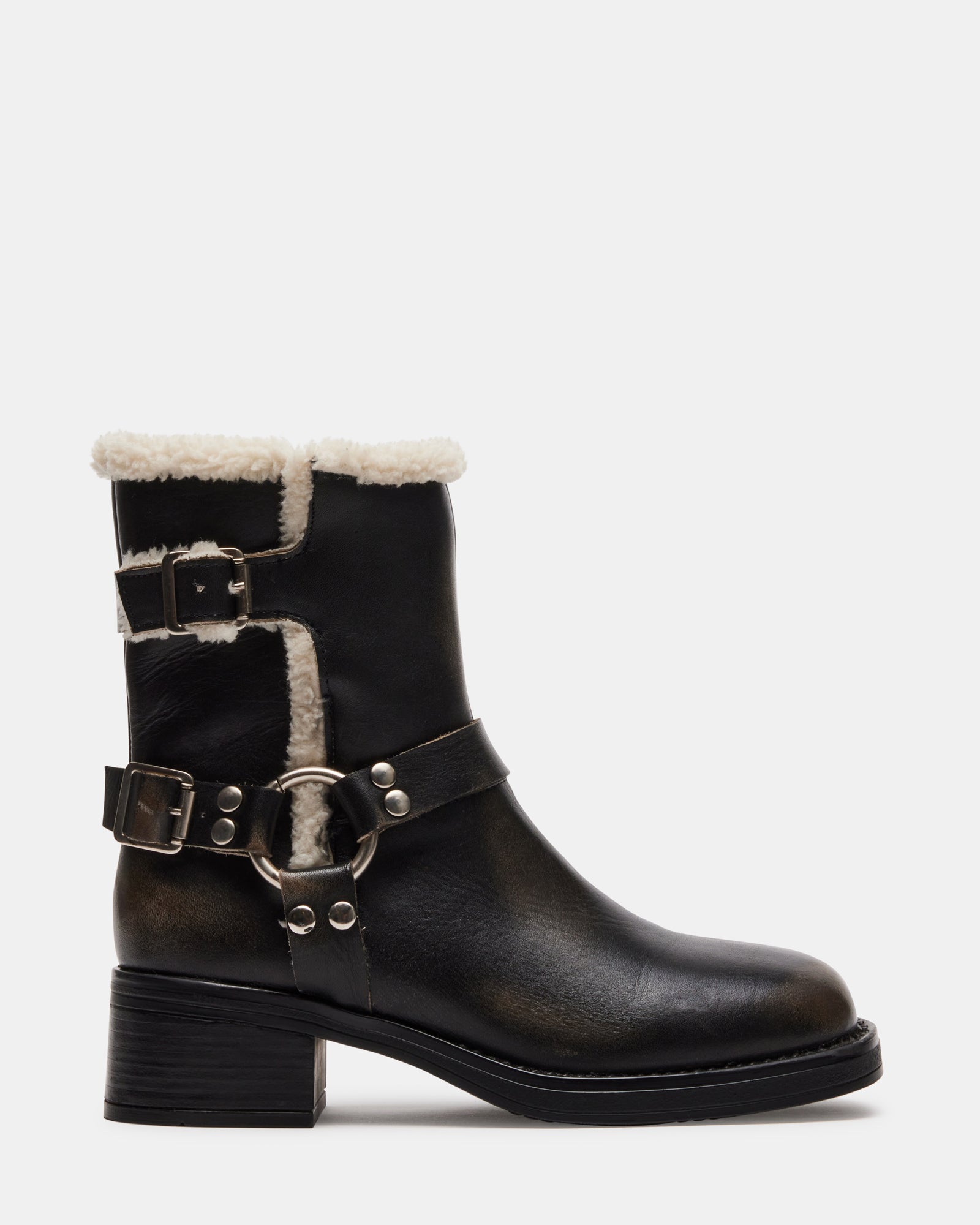 Side profile of brown block heel ankle boots showing buckle detail