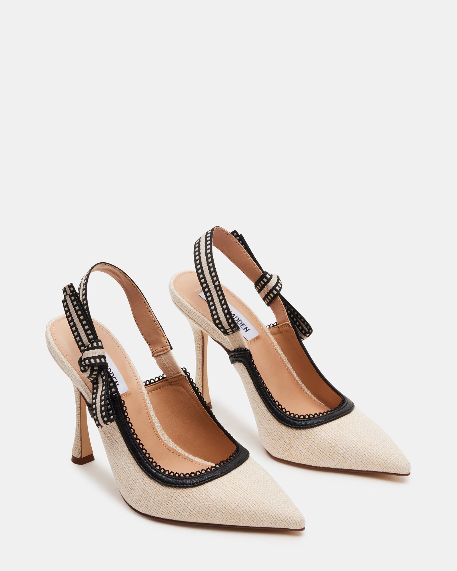 Nude stiletto pumps styled with a summer outfit for evening events