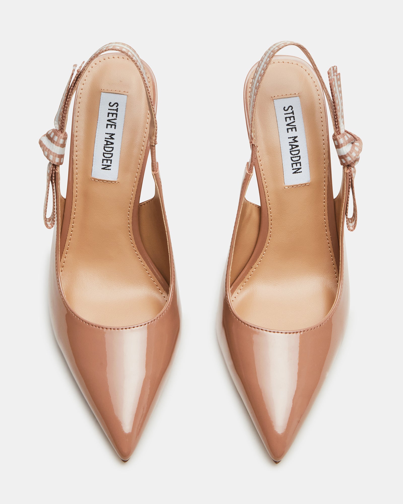 Close-up of the bow detail on the slingback strap of the blush pumps