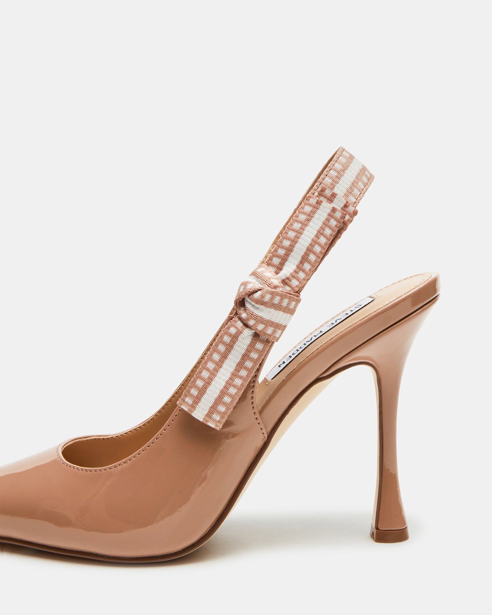 Side view of blush patent point toe pumps with bow accent and 4-inch heel