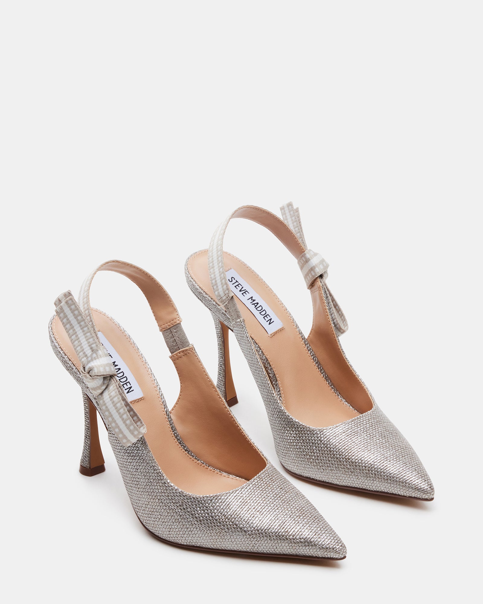 Side profile of silver glitter womens tennis shoes, worn with evening attire