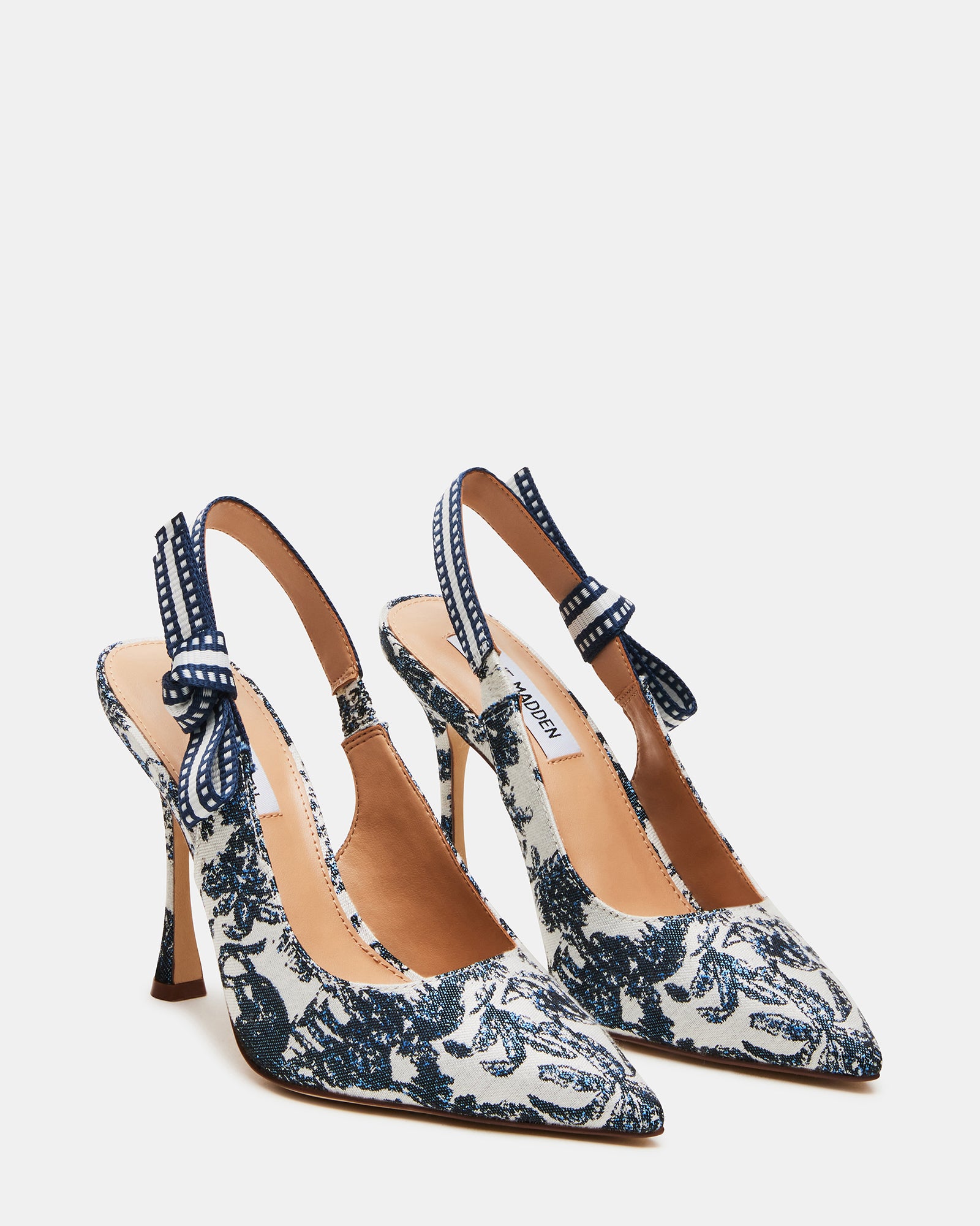 Side profile of nude slingback heels with 4-inch heel