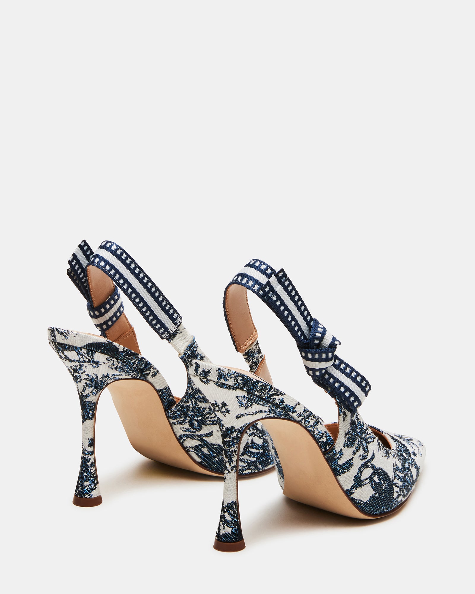 Side profile of nude slingback heels with 4-inch heel