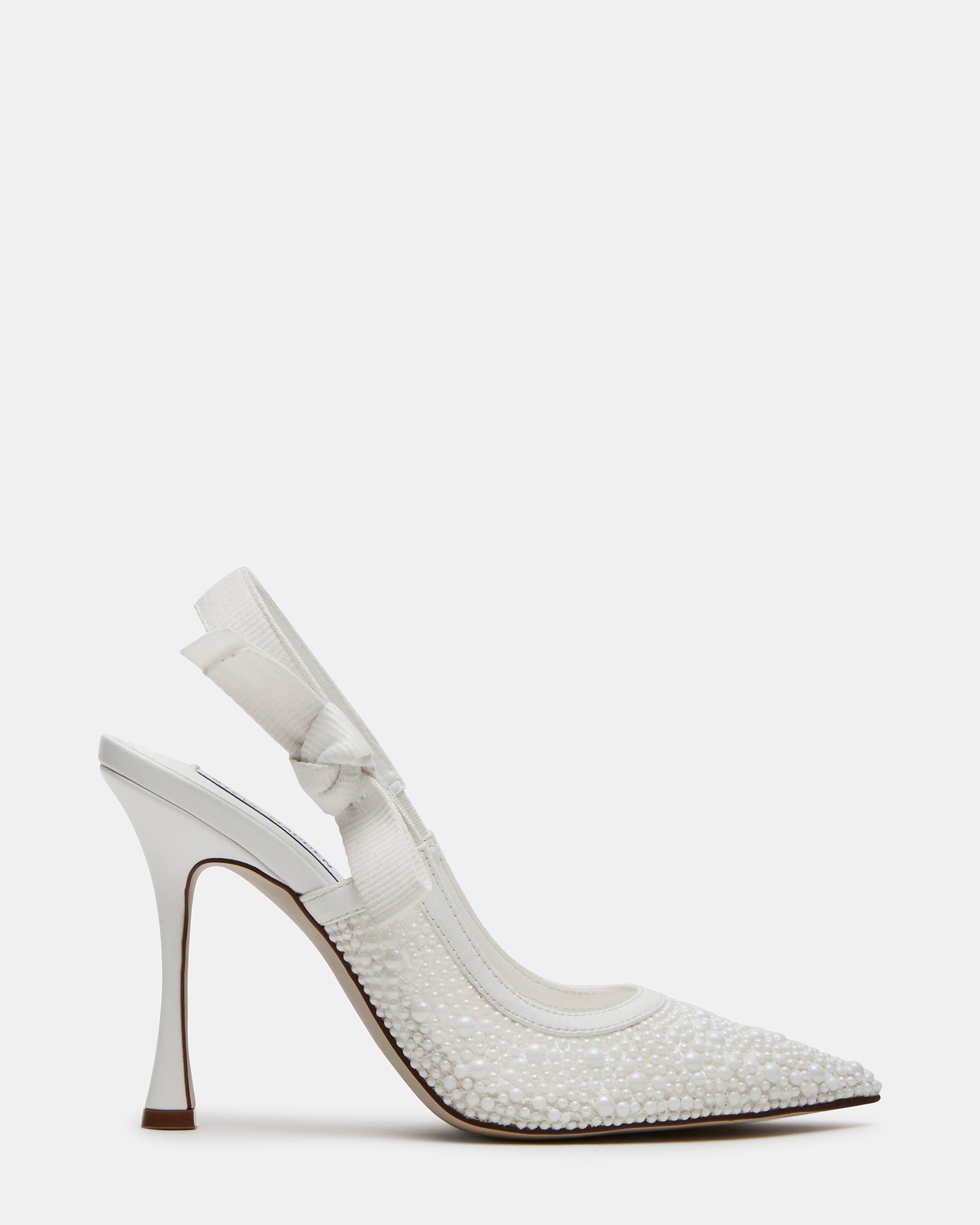 Side view of elegant white lace slingback heels on a model.
