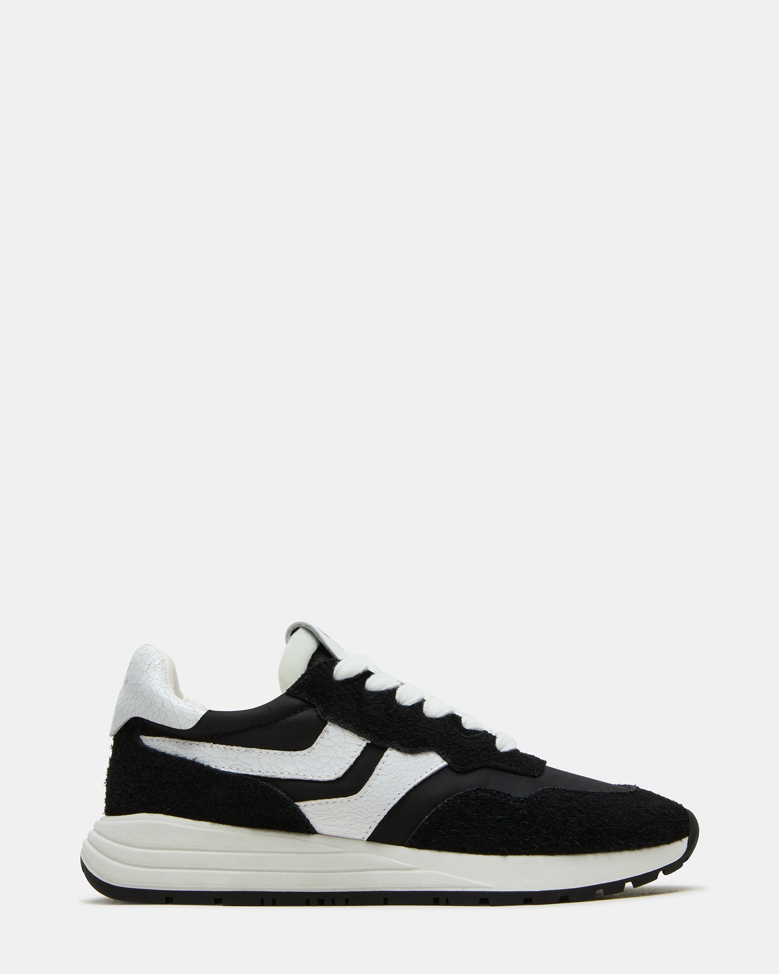 Close-up of versatile Burst black sneakers showcasing sleek design.