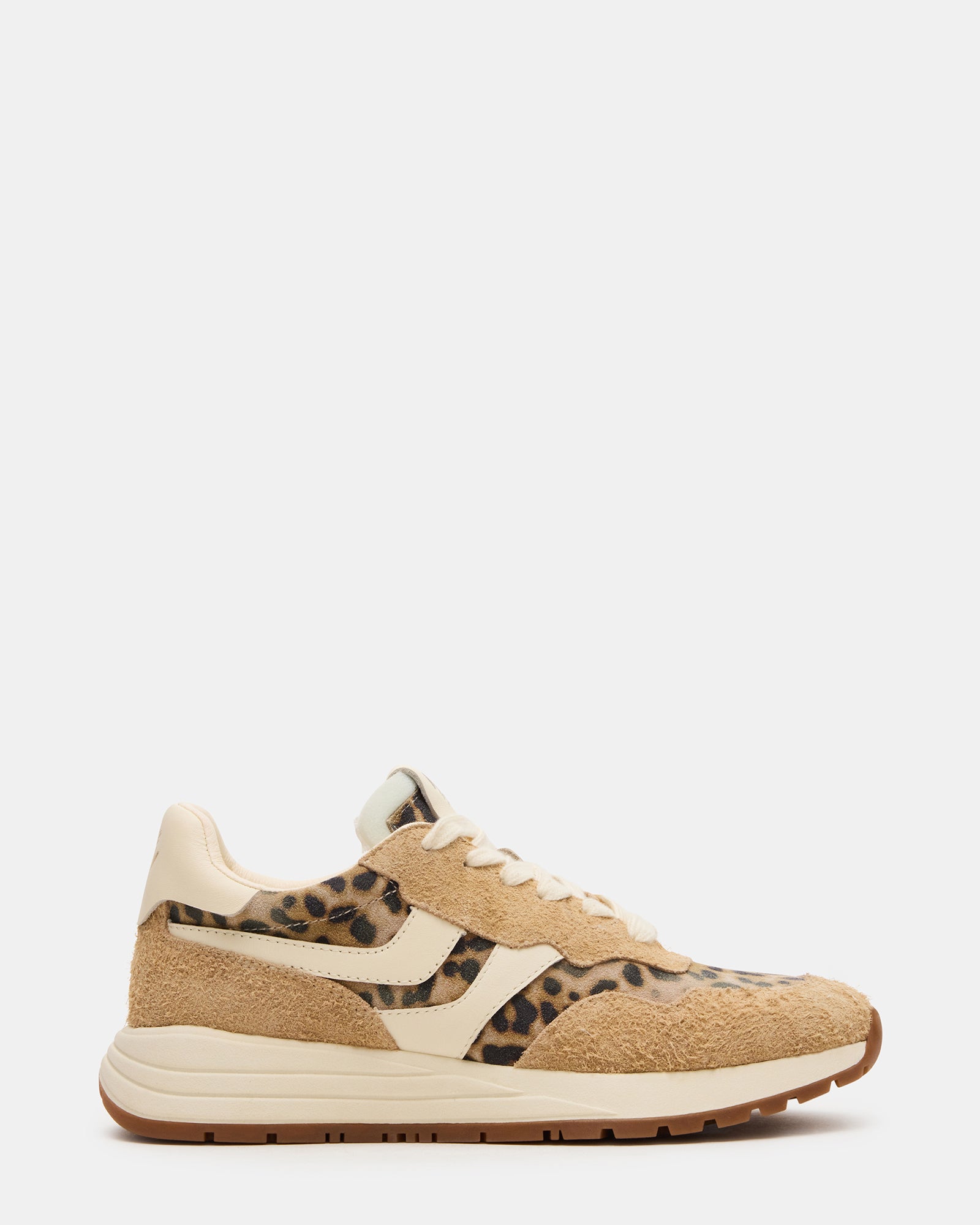 Side view of Bottega leopard lace-up sneakers on a city street.