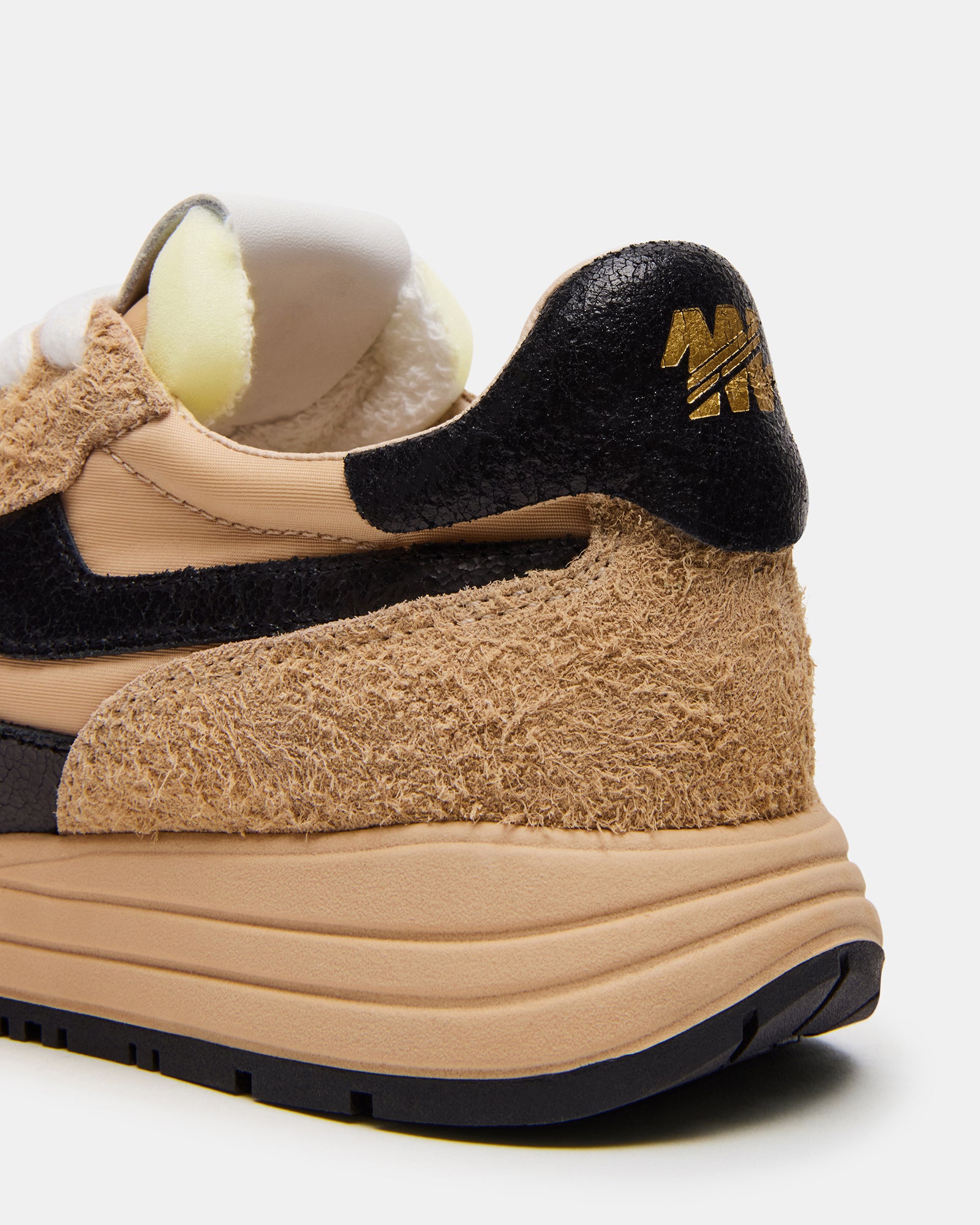 Side view of Burst multi-color low top sneakers highlighting the stylish design