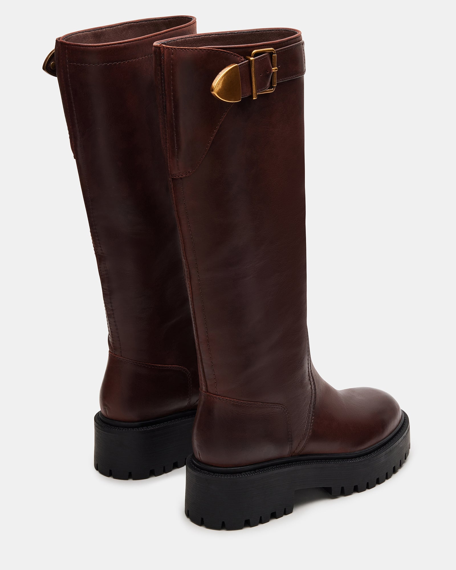 Front angle of cognac womens leather boots styled with denim for casual wear