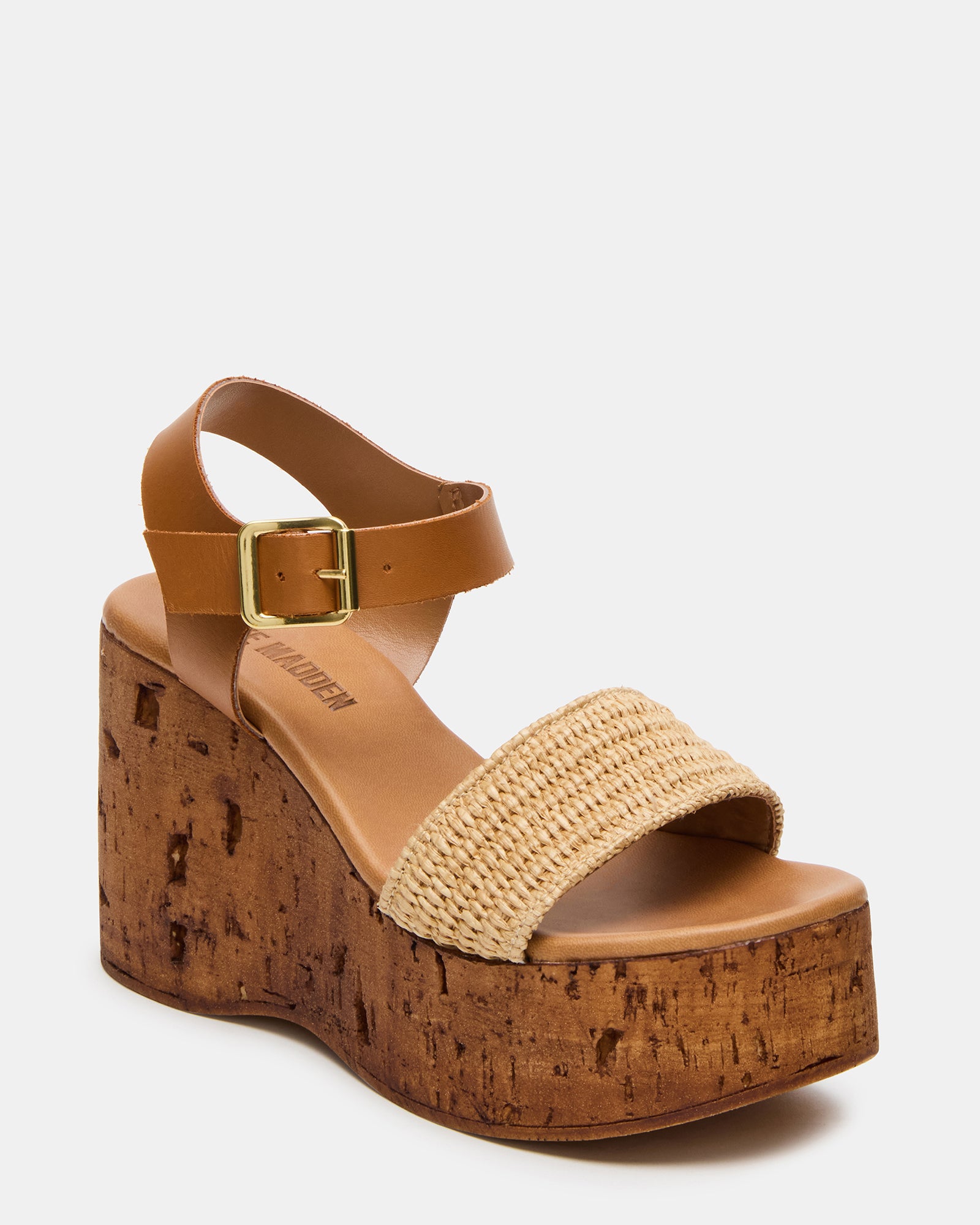 Cabernet Luxe black platform sandals paired with a sundress on wood flooring
