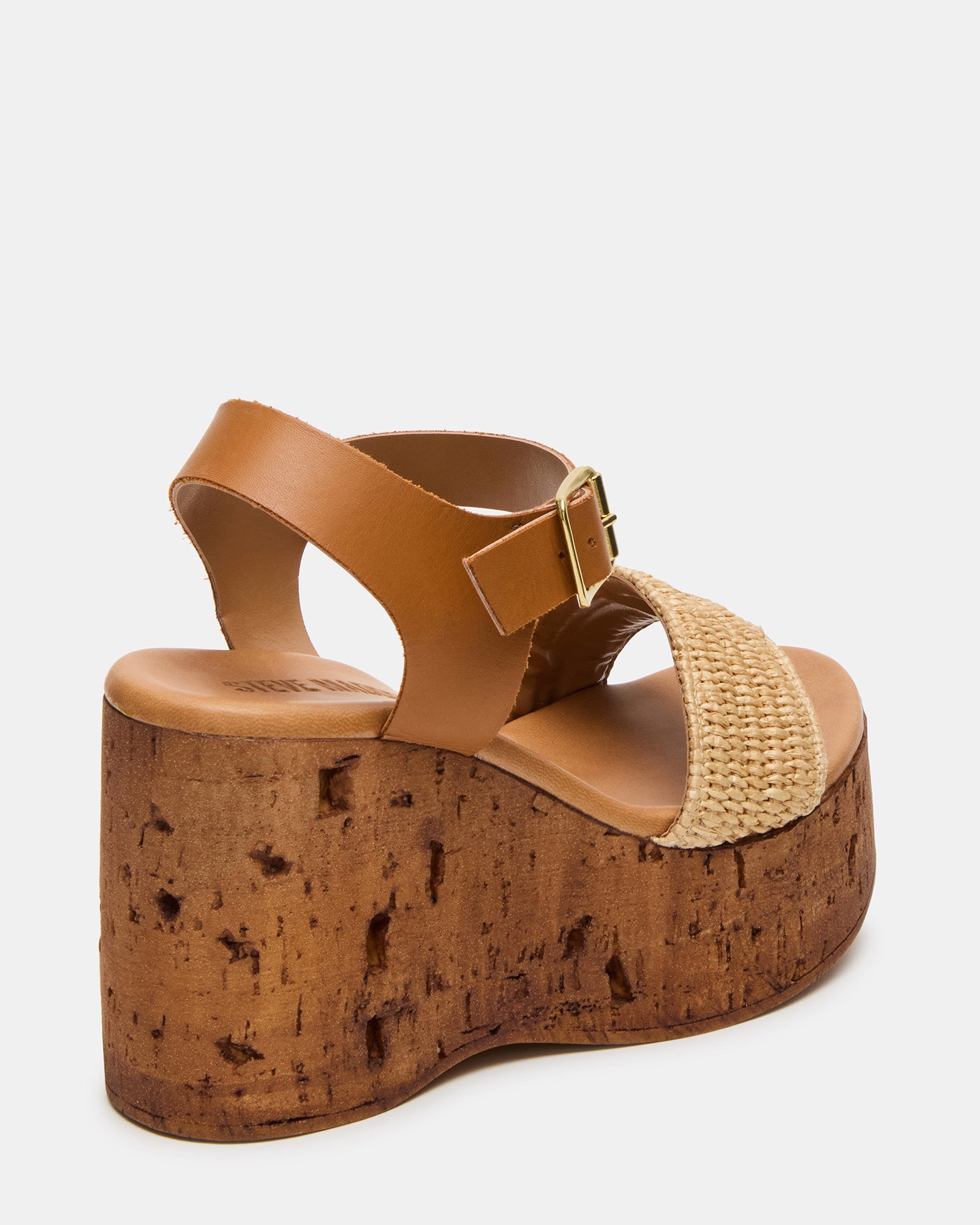 Cabernet Luxe black platform sandals paired with a sundress on wood flooring
