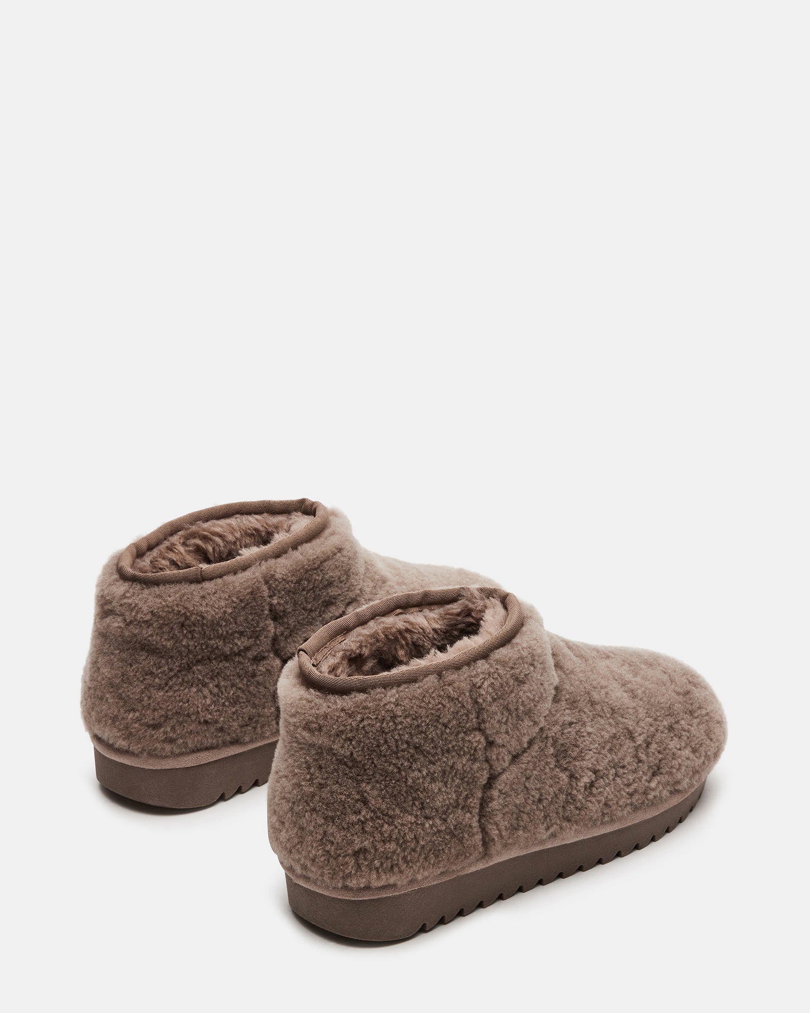 Top-down shot showing faux shearling interior of womens winter boots