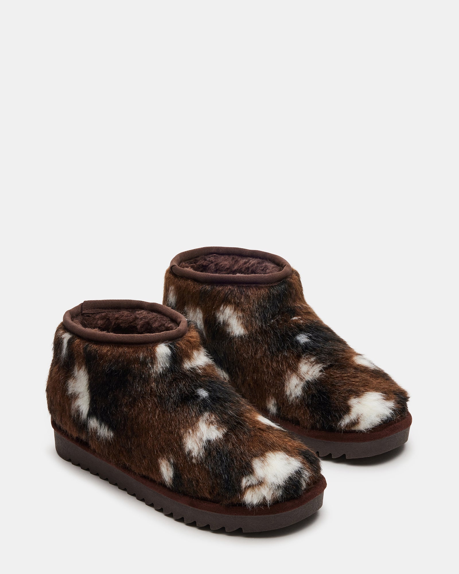 Lifestyle shot of womens warm winter boots worn outdoors