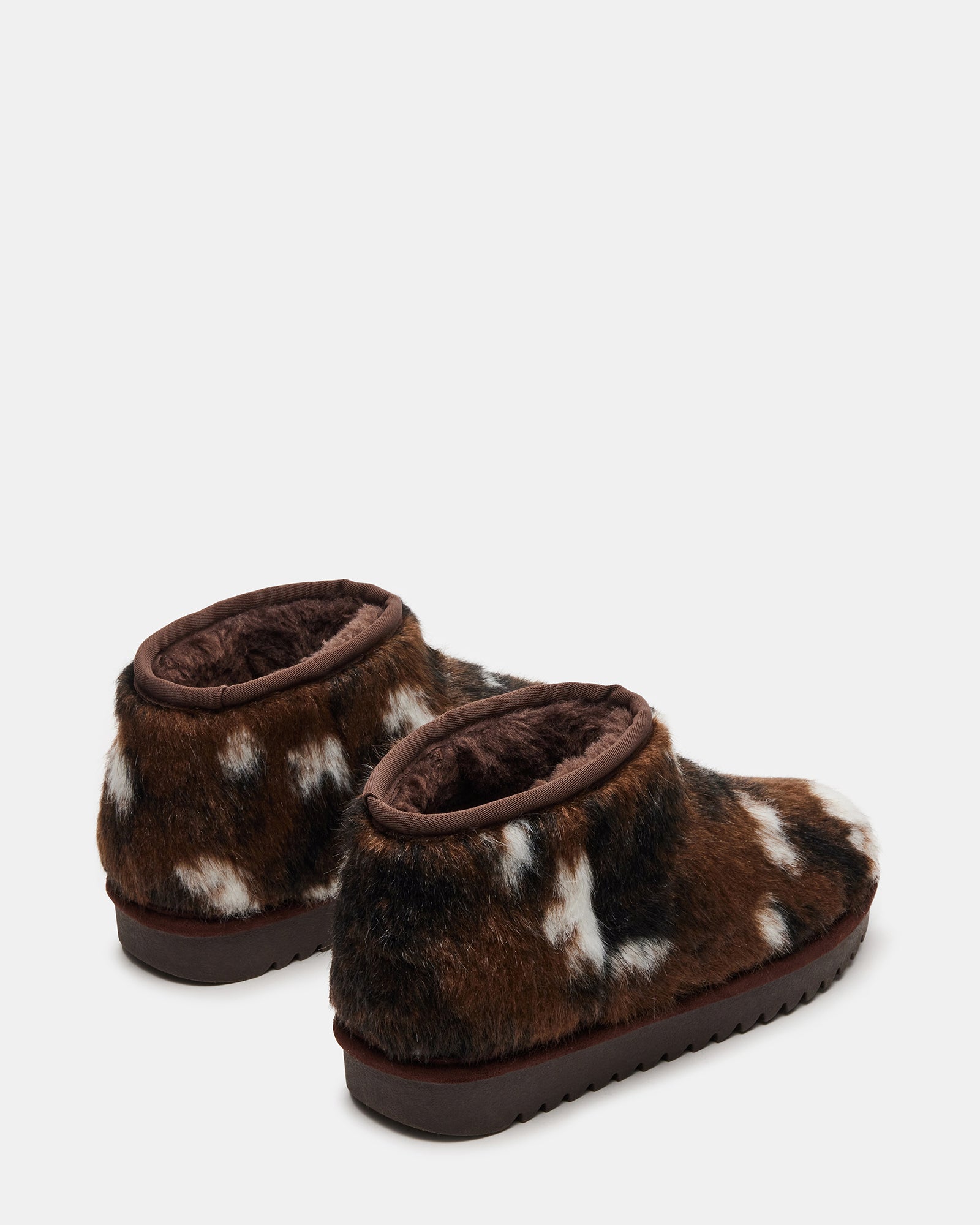Lifestyle shot of womens warm winter boots worn outdoors